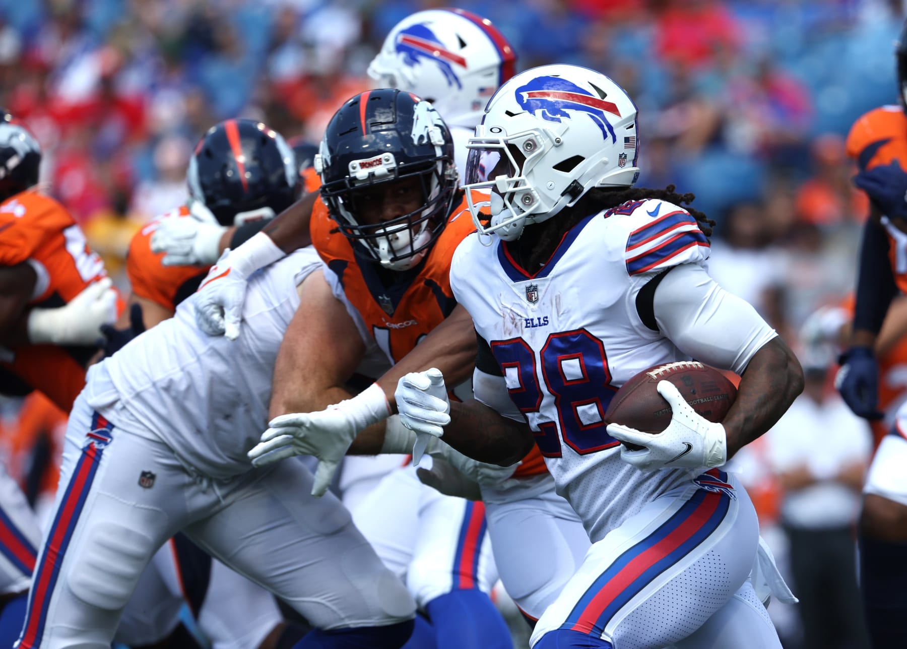 ORCHARD PARK, NY - AUGUST 20: James Cook #28 of the Buffalo Bills runs the ball during the first half of a preseason game against the Denver Broncos at Highmark Stadium on August 20, 2022 in Orchard Park, New York. (Photo by Timothy T Ludwig/Getty Images)