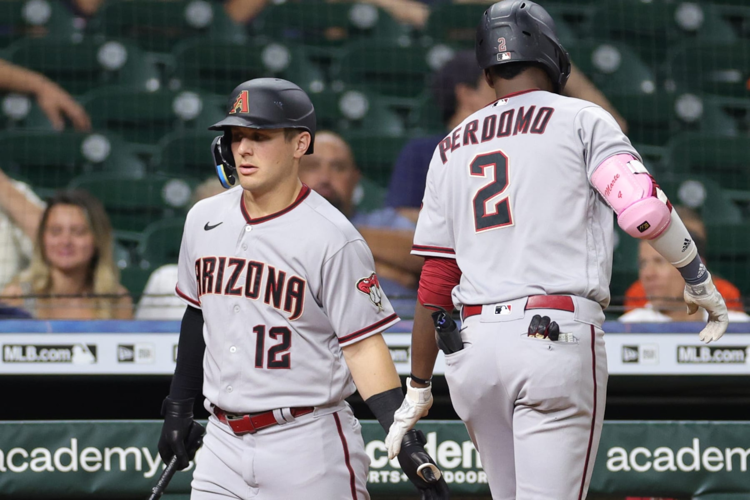 HOUSTON, TEXAS - SEPTEMBER 27: Geraldo Perdomo #2 of the Arizona Diamondbacks high fives Daulton Varsho #12 after hitting a solo home run during the third inning off of Luis Garcia #77 of the Houston Astros at Minute Maid Park on September 27, 2022 in Houston, Texas. (Photo by Carmen Mandato/Getty Images) HOUSTON, TEXAS - SEPTEMBER 27: Geraldo Perdomo #2 of the Arizona Diamondbacks high fives Daulton Varsho #12 after hitting a solo home run during the third inning off of Luis Garcia #77 of the Houston Astros at Minute Maid Park on September 27, 2022 in Houston, Texas. (Photo by Carmen Mandato/Getty Images)