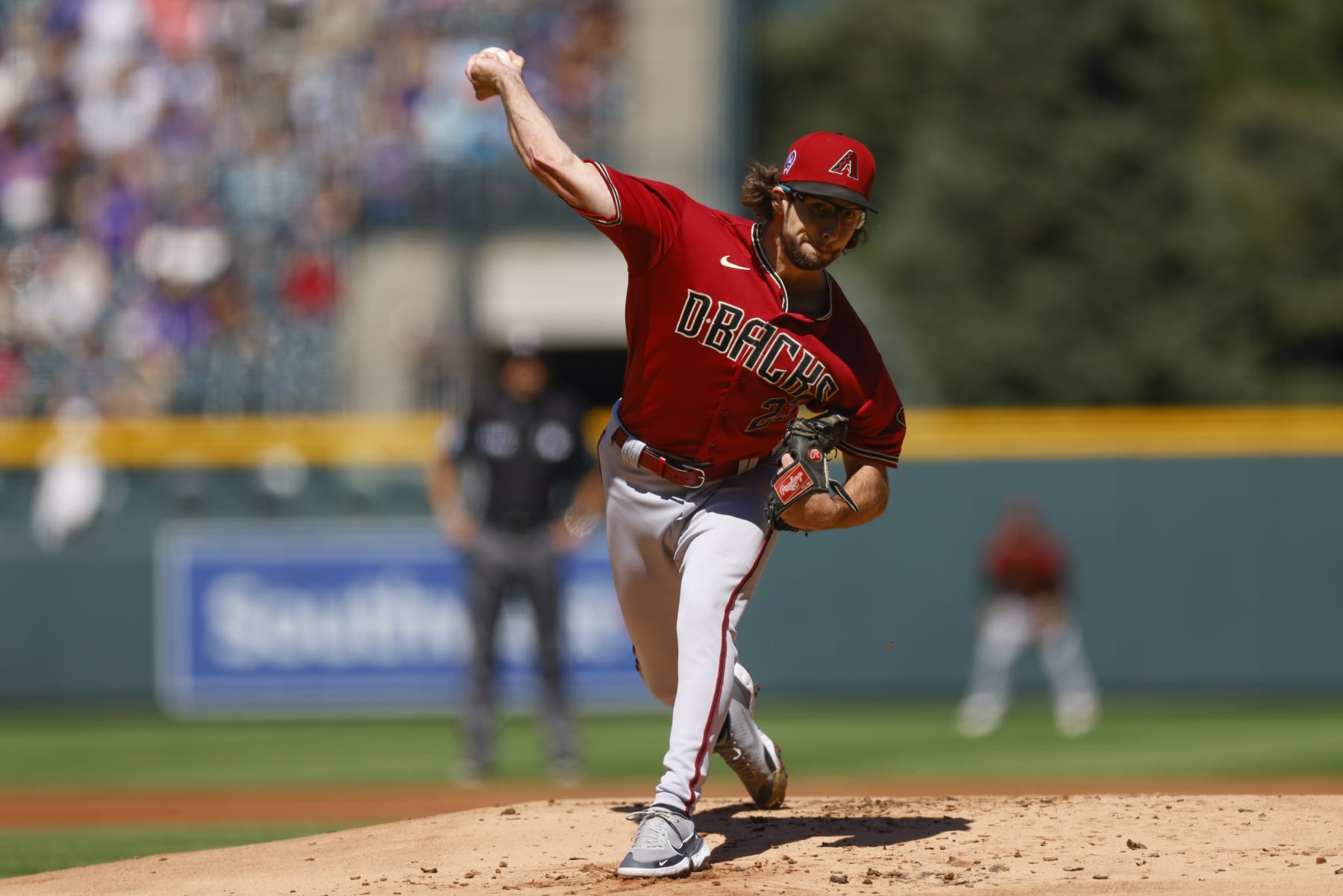 DENVER, CO - SEPTEMBER 11:  Starting pitcher Zac Gallen #23 of the Arizona Diamondbacks delivers to home plate in the first inning against the Colorado Rockies at Coors Field on September 11, 2022 in Denver, Colorado. Gallen set a team record for consecutive scoreless innings at 42.1. (Photo by Justin Edmonds/Getty Images)