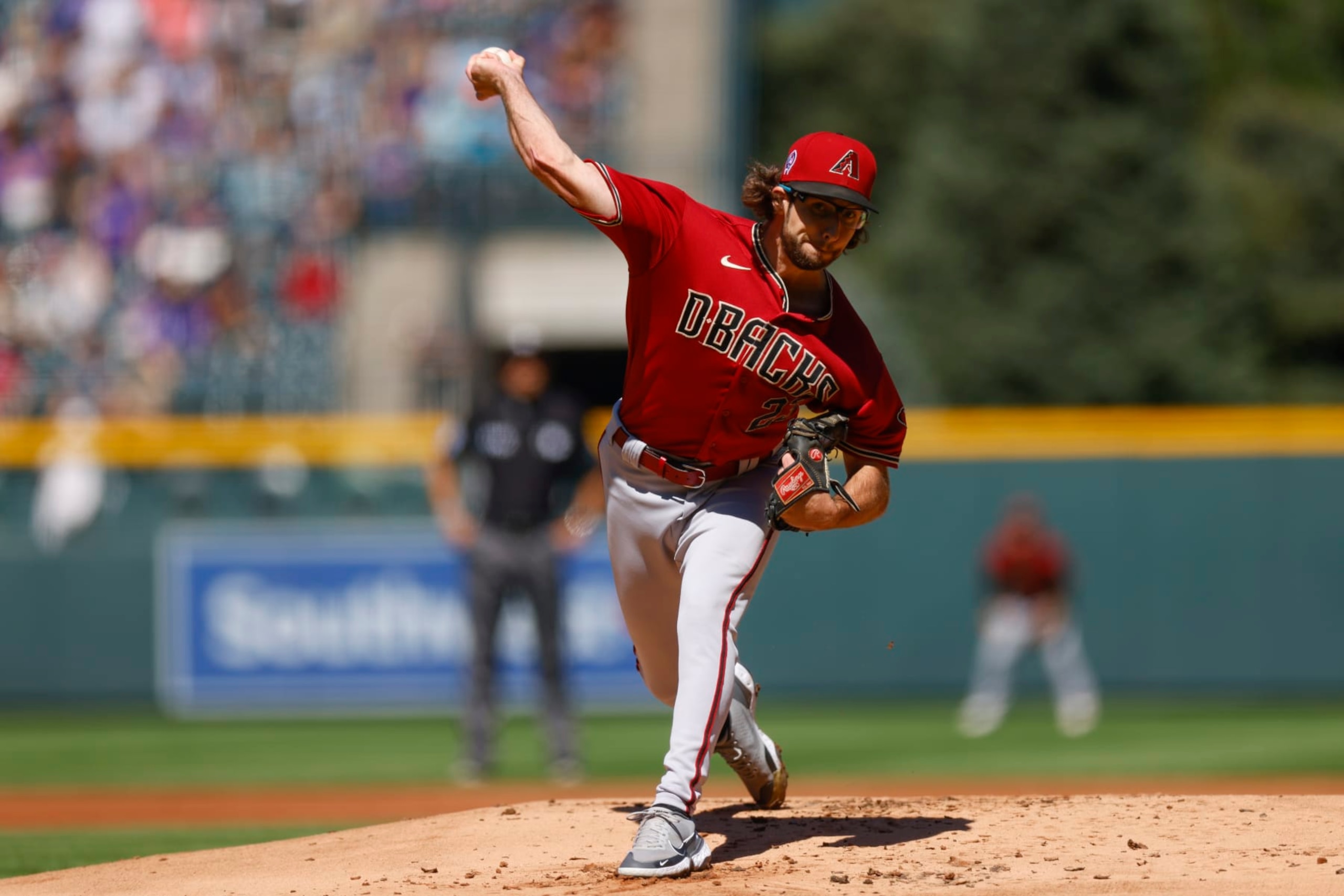 DENVER, CO - SEPTEMBER 11: Starting pitcher Zac Gallen #23 of the Arizona Diamondbacks delivers to home plate in the first inning against the Colorado Rockies at Coors Field on September 11, 2022 in Denver, Colorado. Gallen set a team record for consecutive scoreless innings at 42.1. (Photo by Justin Edmonds/Getty Images) DENVER, CO - SEPTEMBER 11: Starting pitcher Zac Gallen #23 of the Arizona Diamondbacks delivers to home plate in the first inning against the Colorado Rockies at Coors Field on September 11, 2022 in Denver, Colorado. Gallen set a team record for consecutive scoreless innings at 42.1. (Photo by Justin Edmonds/Getty Images)