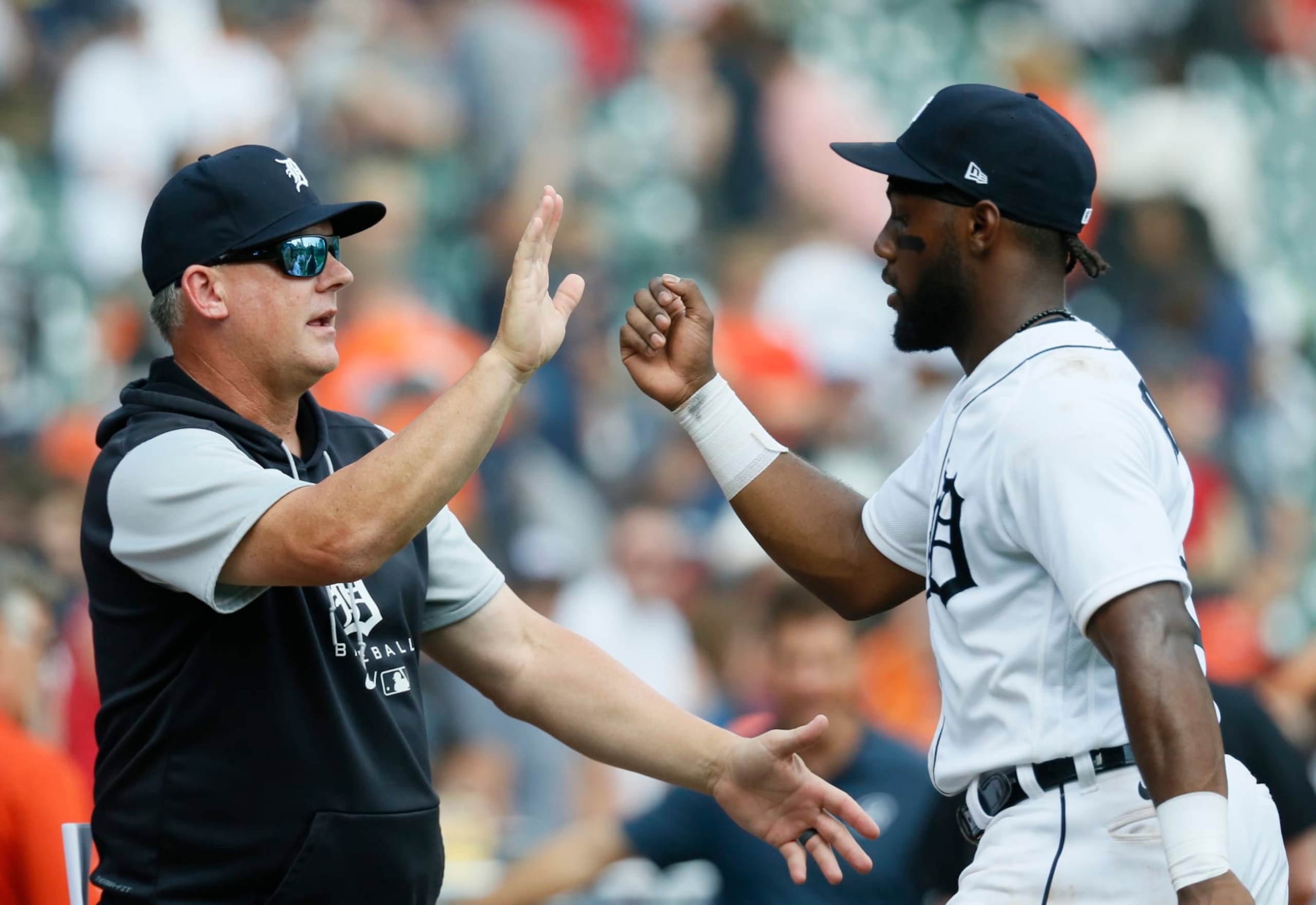 DETROIT, MI - AUGUST 21: Manager A.J. Hinch #14 of the Detroit Tigers celebrates with Akil Baddoo #60 after a win over the Los Angeles Angels at Comerica Park on August 21, 2022, in Detroit, Michigan. (Photo by Duane Burleson/Getty Images) DETROIT, MI - AUGUST 21: Manager A.J. Hinch #14 of the Detroit Tigers celebrates with Akil Baddoo #60 after a win over the Los Angeles Angels at Comerica Park on August 21, 2022, in Detroit, Michigan. (Photo by Duane Burleson/Getty Images)