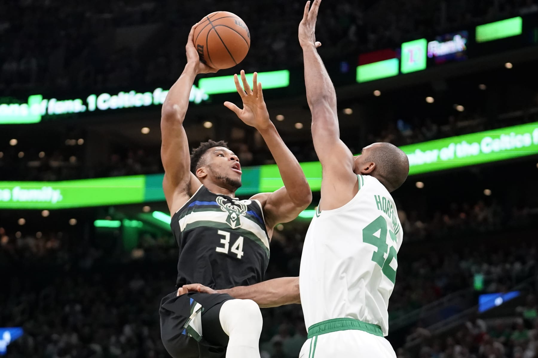 Milwaukee Bucks forward Giannis Antetokounmpo (34) shoots at the basket as Boston Celtics center Al Horford (42) defends during the first half of Game 7 of an NBA basketball Eastern Conference semifinals playoff series, Sunday, May 15, 2022, in Boston. (AP Photo/Steven Senne) Milwaukee Bucks forward Giannis Antetokounmpo (34) shoots at the basket as Boston Celtics center Al Horford (42) defends during the first half of Game 7 of an NBA basketball Eastern Conference semifinals playoff series, Sunday, May 15, 2022, in Boston. (AP Photo/Steven Senne)