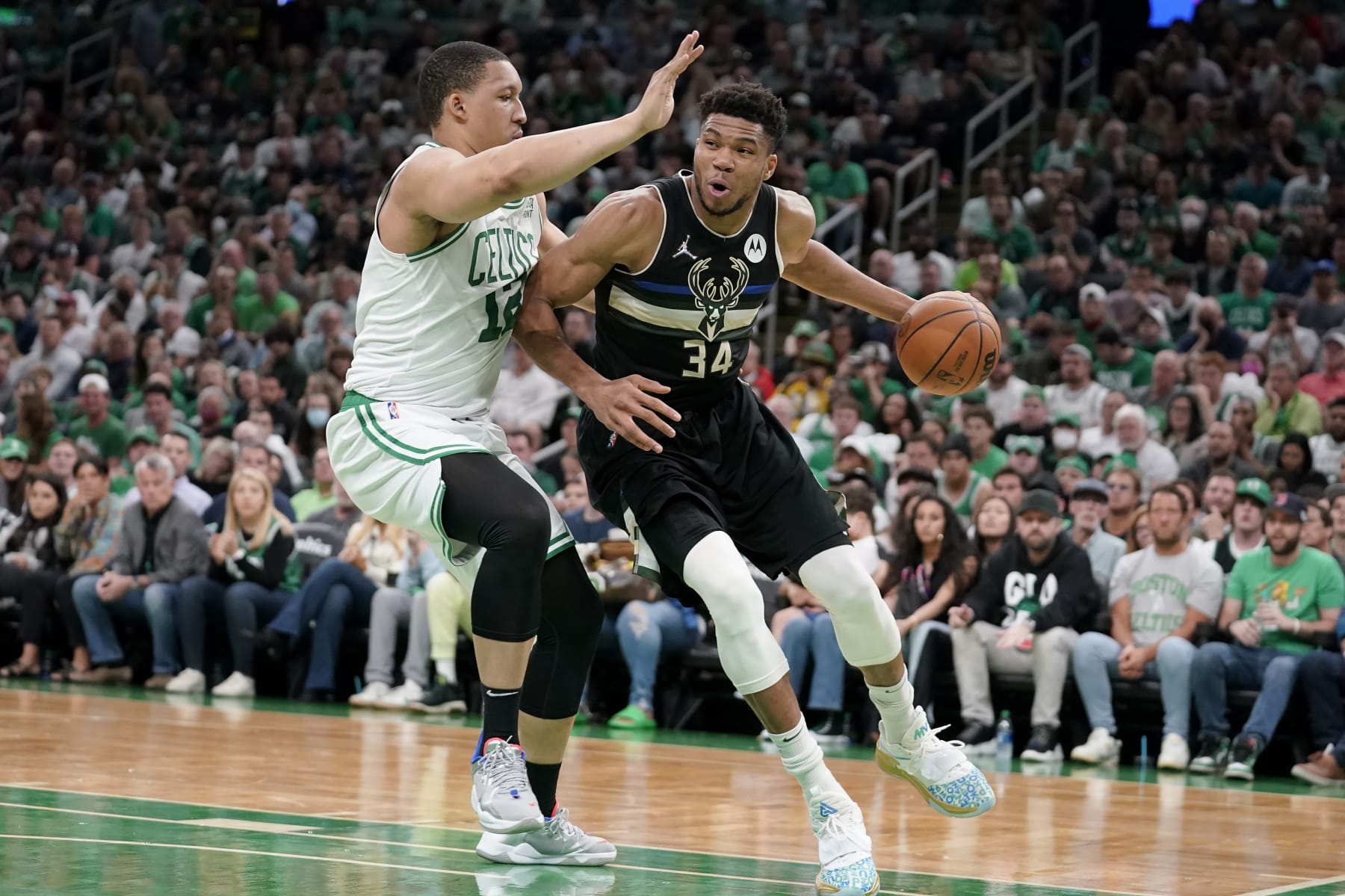 Boston Celtics forward Grant Williams (12) defends as Milwaukee Bucks forward Giannis Antetokounmpo (34) drives toward the basket during the first half of Game 7 of an NBA basketball Eastern Conference semifinals playoff series, Sunday, May 15, 2022, in Boston. (AP Photo/Steven Senne) Boston Celtics forward Grant Williams (12) defends as Milwaukee Bucks forward Giannis Antetokounmpo (34) drives toward the basket during the first half of Game 7 of an NBA basketball Eastern Conference semifinals playoff series, Sunday, May 15, 2022, in Boston. (AP Photo/Steven Senne)