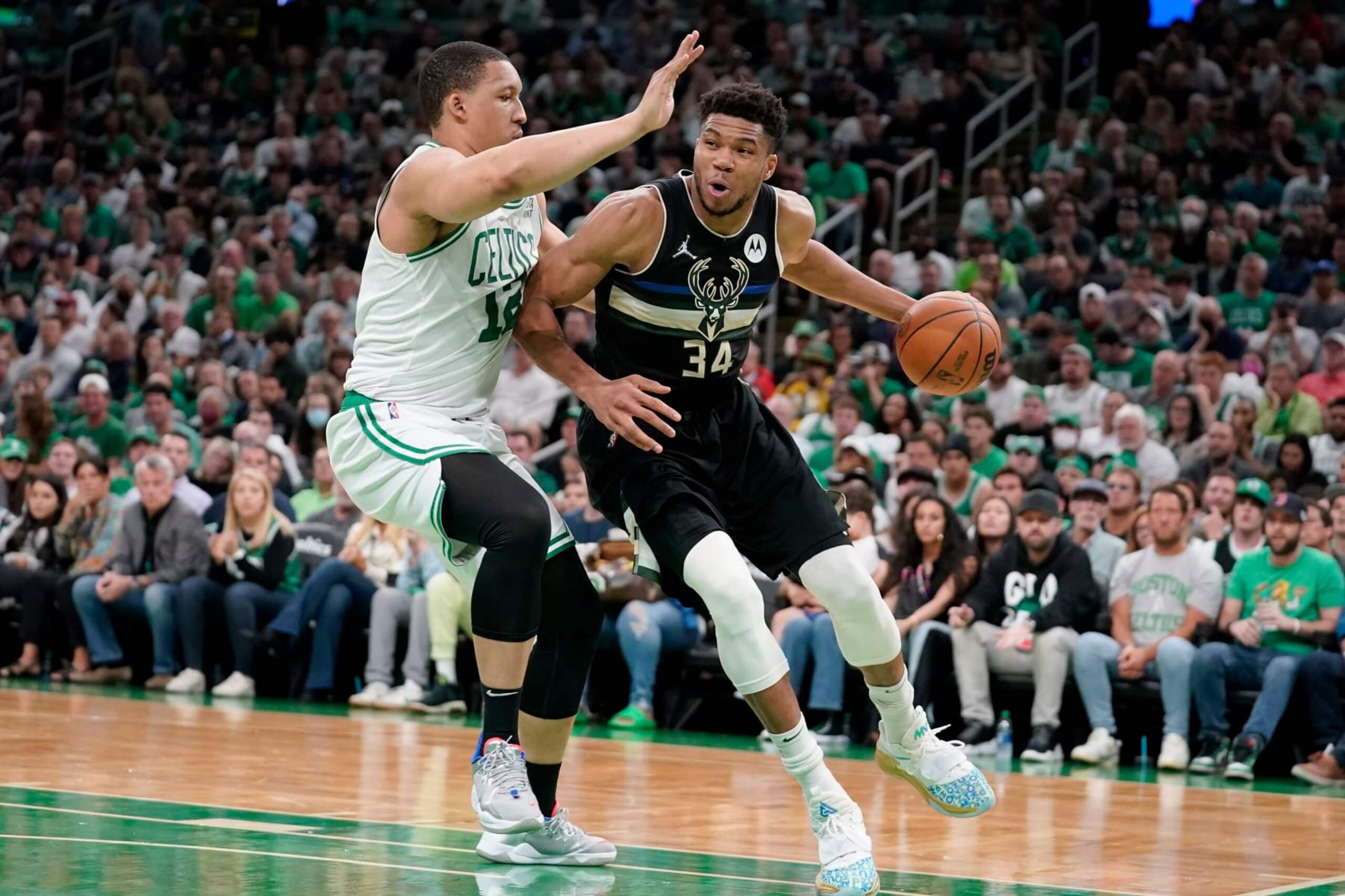 Boston Celtics forward Grant Williams (12) defends as Milwaukee Bucks forward Giannis Antetokounmpo (34) drives toward the basket during the first half of Game 7 of an NBA basketball Eastern Conference semifinals playoff series, Sunday, May 15, 2022, in Boston. (AP Photo/Steven Senne) Boston Celtics forward Grant Williams (12) defends as Milwaukee Bucks forward Giannis Antetokounmpo (34) drives toward the basket during the first half of Game 7 of an NBA basketball Eastern Conference semifinals playoff series, Sunday, May 15, 2022, in Boston. (AP Photo/Steven Senne)