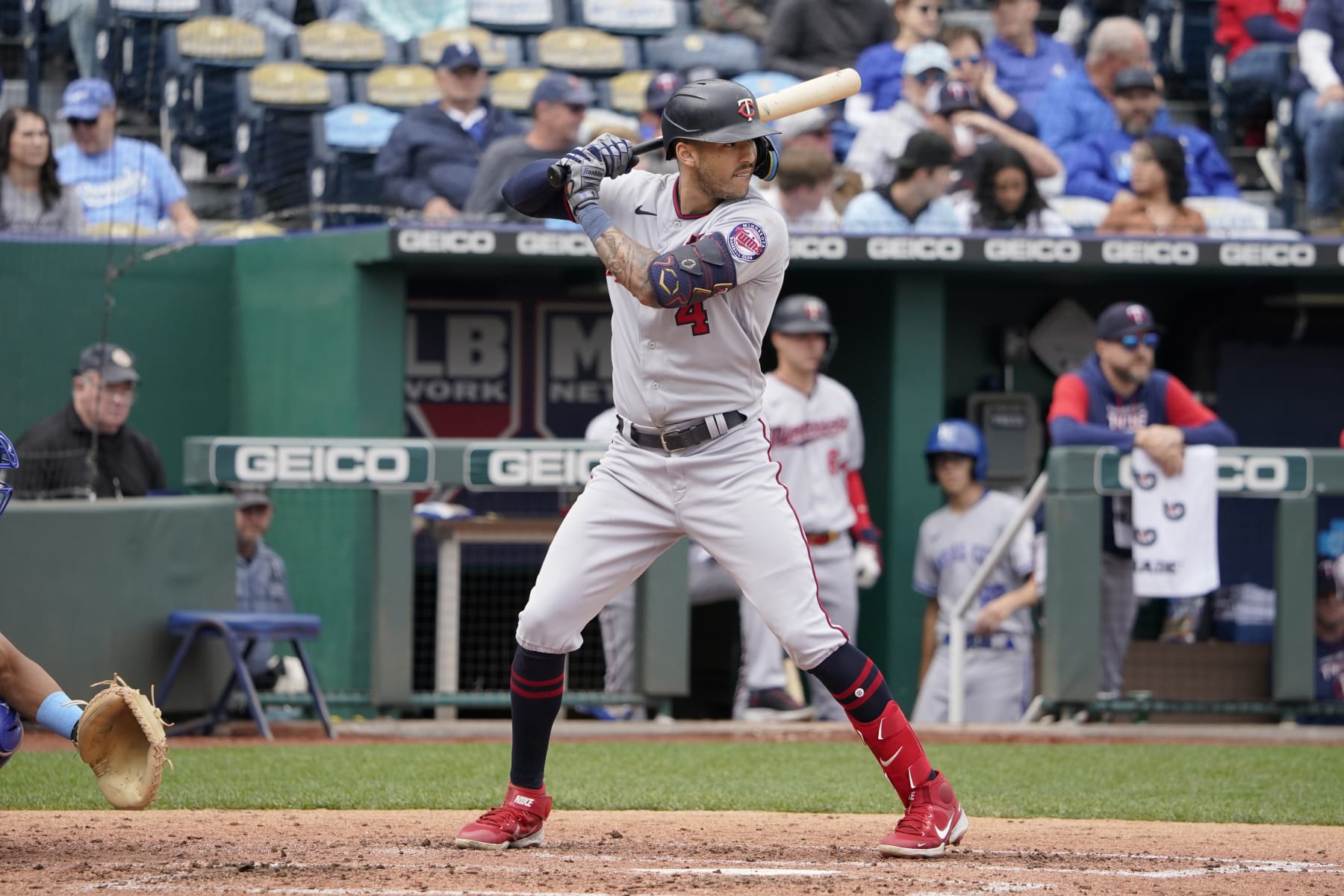 KANSAS CITY, MISSOURI - SEPTEMBER 22:  Carlos Correa #4 of the Minnesota Twins bats against the Kansas City Royals at Kauffman Stadium on September 22, 2022 in Kansas City, Missouri. (Photo by Ed Zurga/Getty Images)