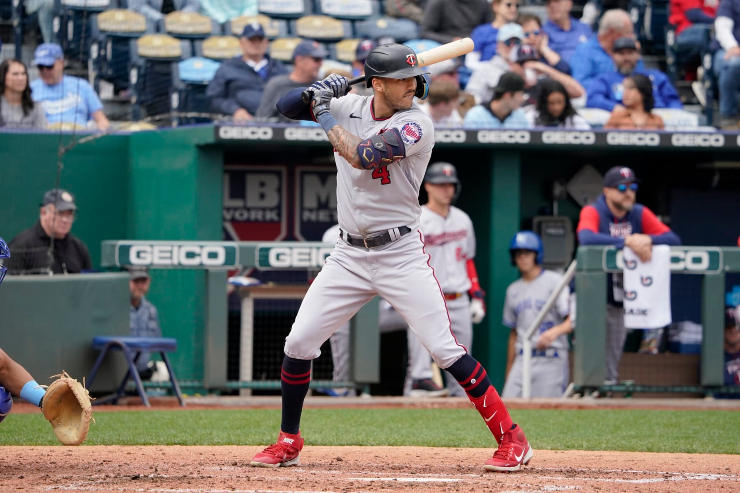 KANSAS CITY, MISSOURI - SEPTEMBER 22:  Carlos Correa #4 of the Minnesota Twins bats against the Kansas City Royals at Kauffman Stadium on September 22, 2022 in Kansas City, Missouri. (Photo by Ed Zurga/Getty Images)