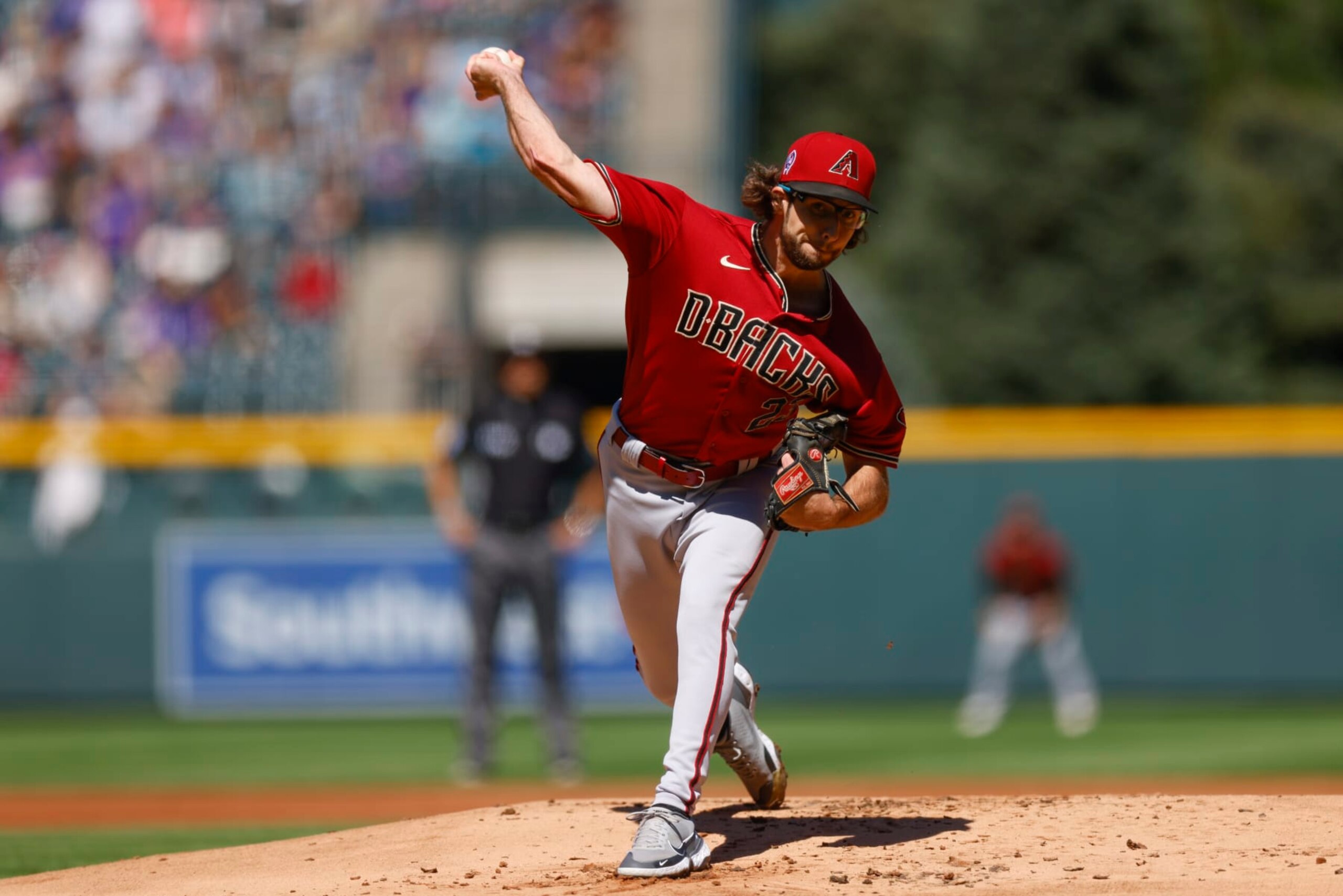 DENVER, CO - SEPTEMBER 11:  Starting pitcher Zac Gallen #23 of the Arizona Diamondbacks delivers to home plate in the first inning against the Colorado Rockies at Coors Field on September 11, 2022 in Denver, Colorado. Gallen set a team record for consecutive scoreless innings at 42.1. (Photo by Justin Edmonds/Getty Images)