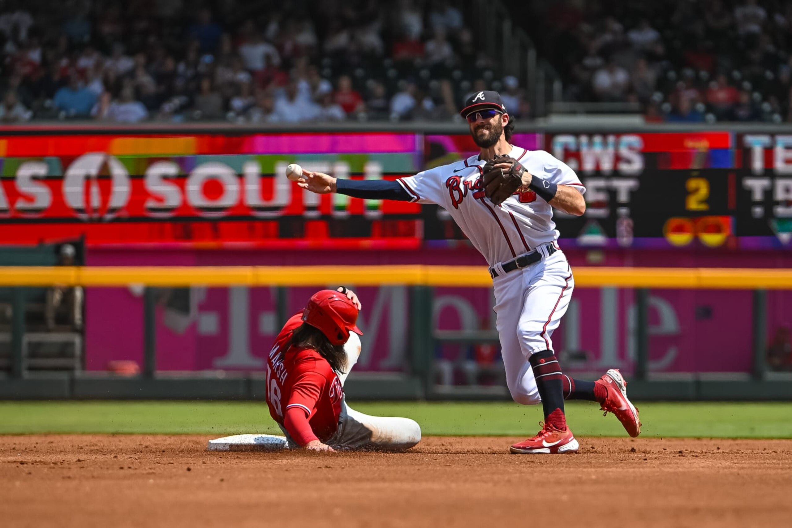 ATLANTA, GA - SEPTEMBER 18: Atlanta Braves shortstop Dansby Swanson (7) turns a double play in the third inning during the MLB game between the Philadelphia Phillies and Atlanta Braves on September 18, 2022, at Truist Park in Atlanta, GA. (Photo by John Adams/Icon Sportswire via Getty Images)