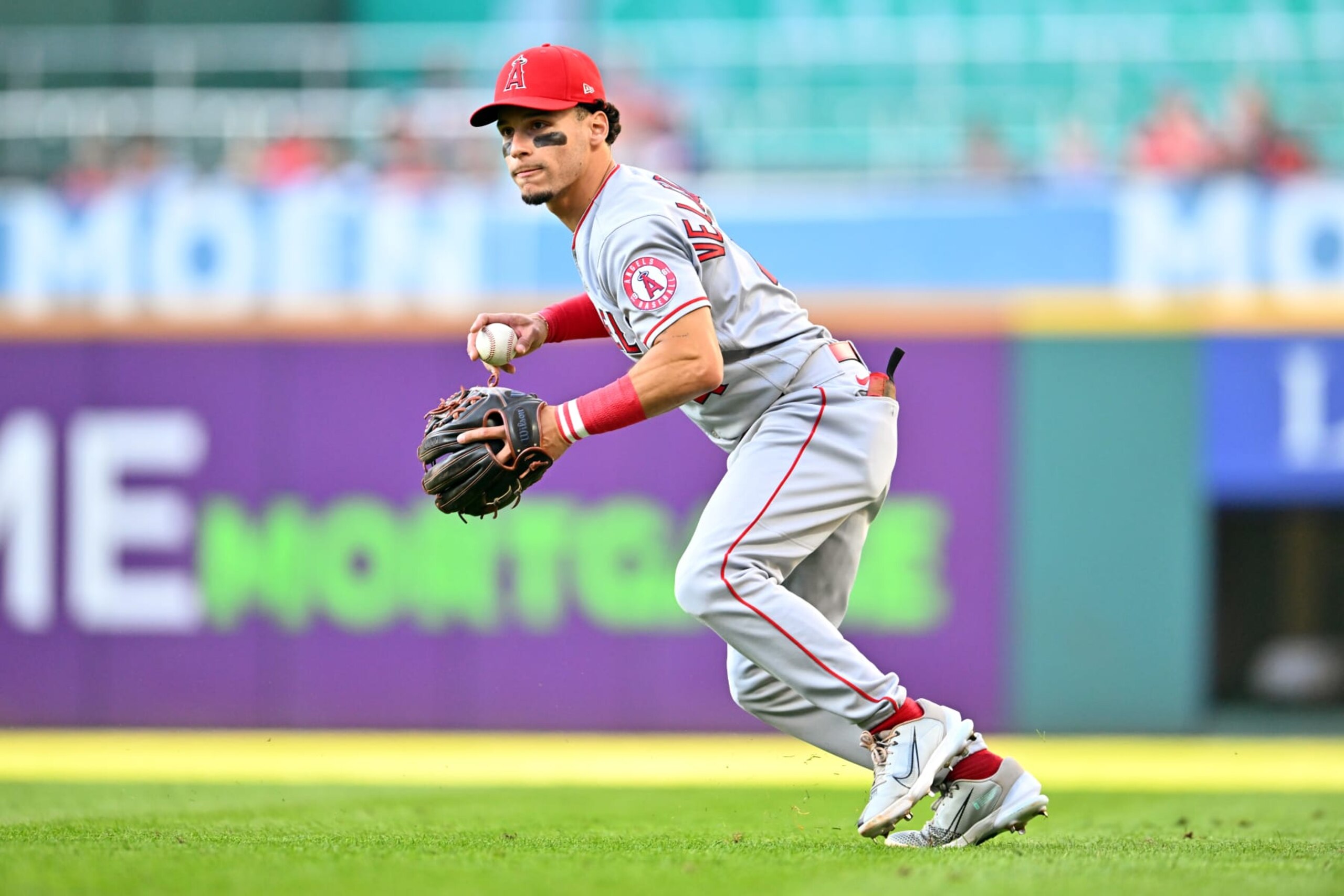 CLEVELAND, OHIO - SEPTEMBER 13: Shortstop Andrew Velazquez #4 of the Los Angeles Angels throws out Josh Naylor #22 of the Cleveland Guardians at first during the second inning at Progressive Field on September 13, 2022 in Cleveland, Ohio. (Photo by Jason Miller/Getty Images)