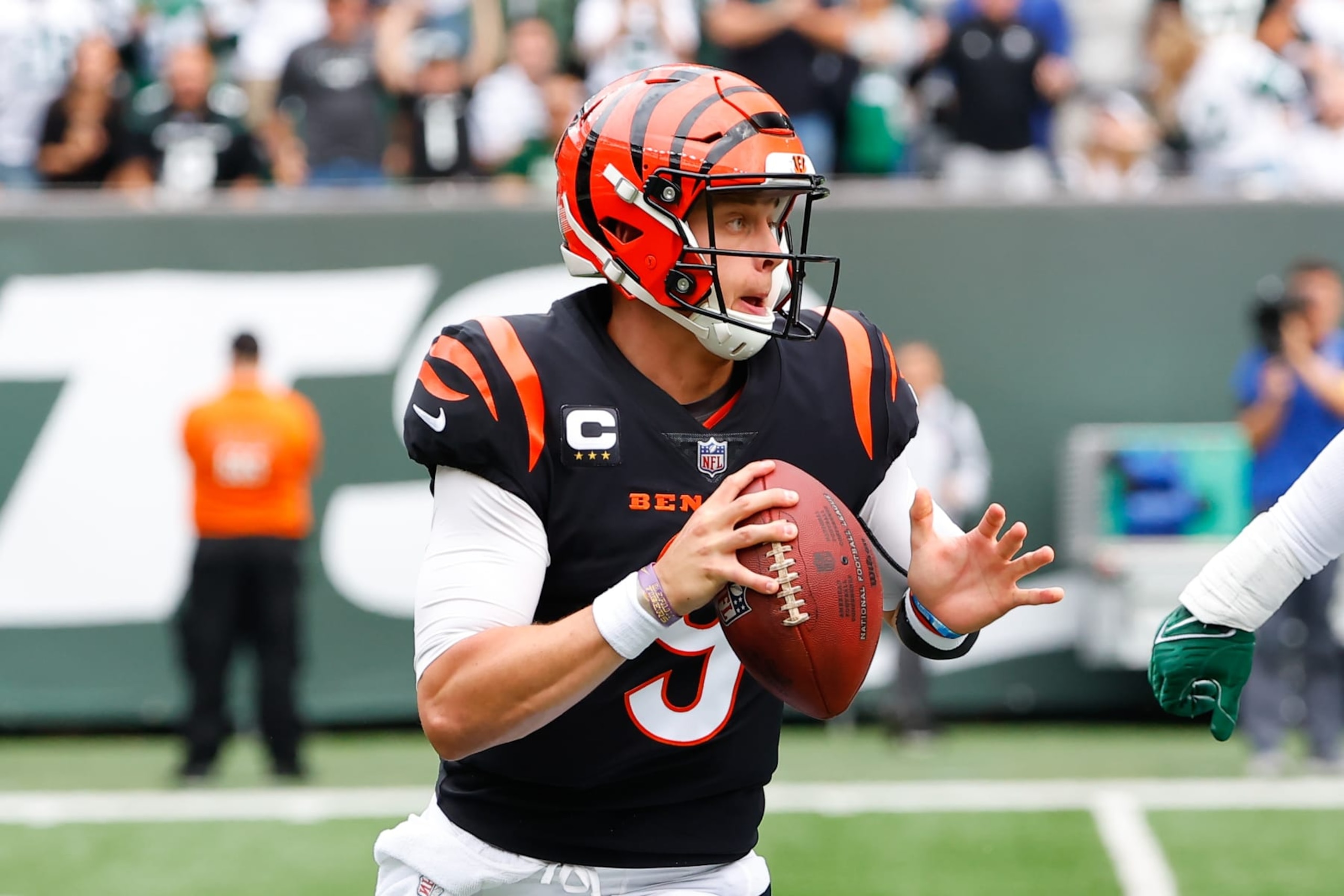 EAST RUTHERFORD, NJ - SEPTEMBER 25:  Cincinnati Bengals quarterback Joe Burrow (9) rolls out during the National Football League game between the New York Jets and the Cincinnati Bengals on September 25, 2022 at MetLife Stadium in East Rutherford, New Jersey.  (Photo by Rich Graessle/Icon Sportswire via Getty Images)