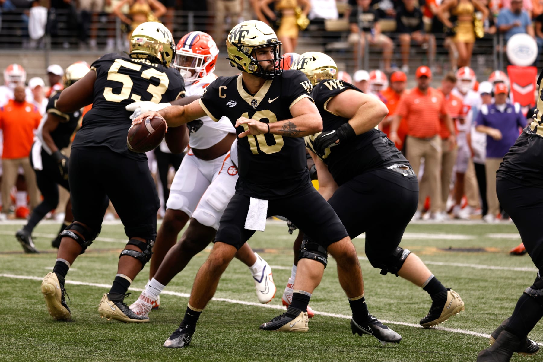 WINSTON-SALEM, NC - SEPTEMBER 24: Sam Hartman #10 of the Wake Forest Demon Deacons drops back to pass against the Clemson Tigers at Truist Field on September 24, 2022 in Winston-Salem, North Carolina. Clemson won 51-45 in 2OT. (Photo by Lance King/Getty Images)