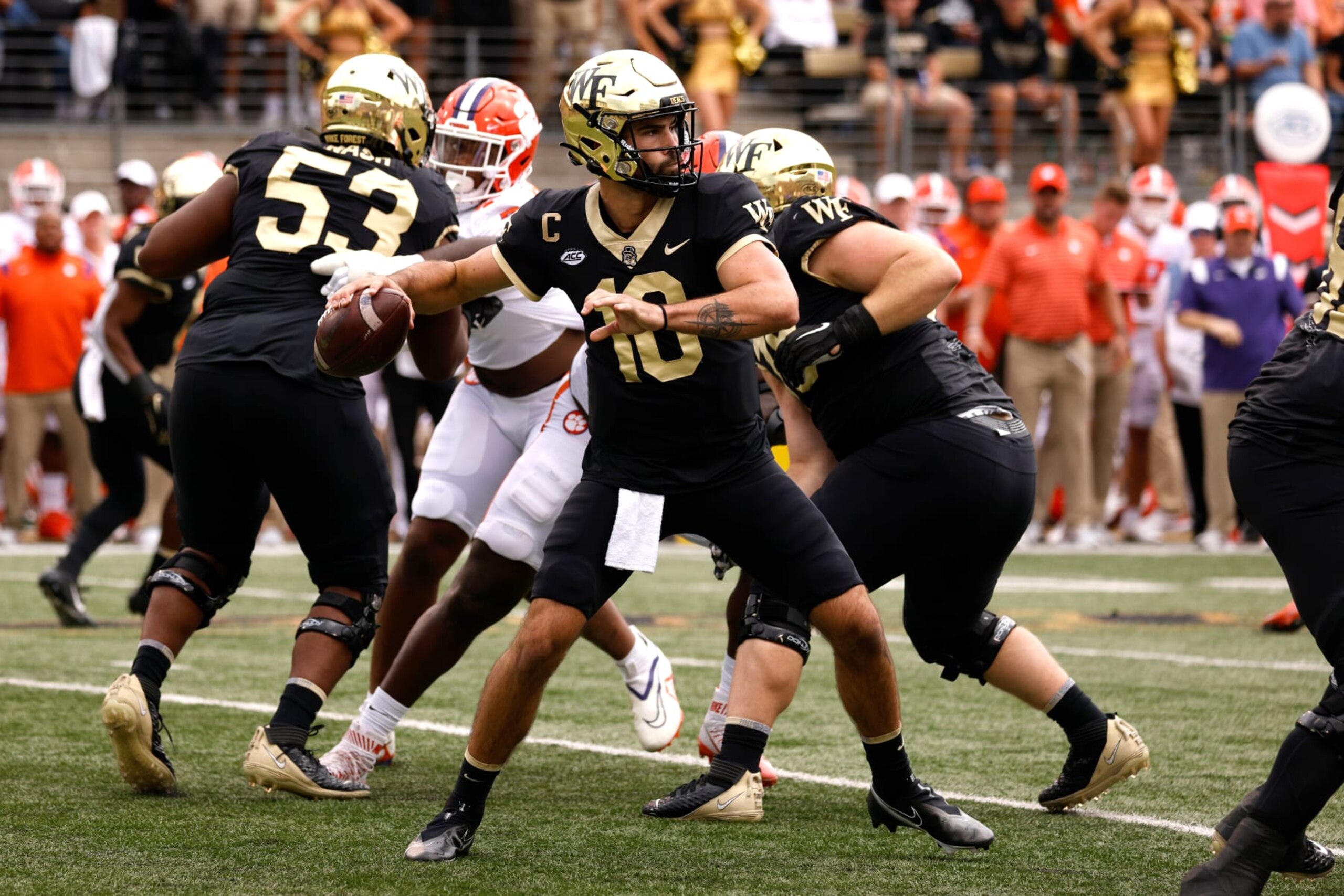 WINSTON-SALEM, NC - SEPTEMBER 24: Sam Hartman #10 of the Wake Forest Demon Deacons drops back to pass against the Clemson Tigers at Truist Field on September 24, 2022 in Winston-Salem, North Carolina. Clemson won 51-45 in 2OT. (Photo by Lance King/Getty Images)