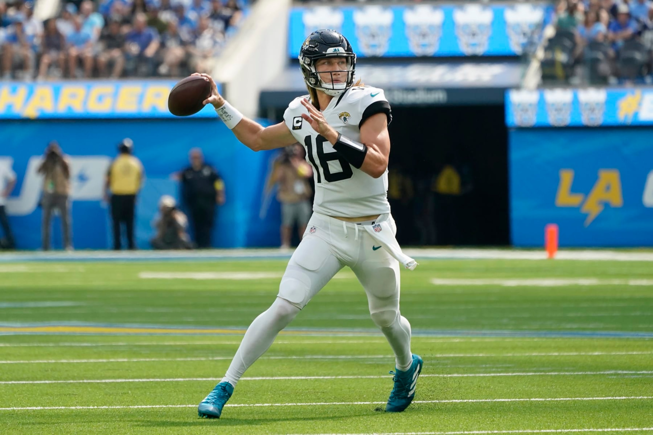 Jacksonville Jaguars quarterback Trevor Lawrence (16) passes against the Los Angeles Chargers during the first half of an NFL football game in Inglewood, Calif., Sunday, Sept. 25, 2022. (AP Photo/Marcio Jose Sanchez)
