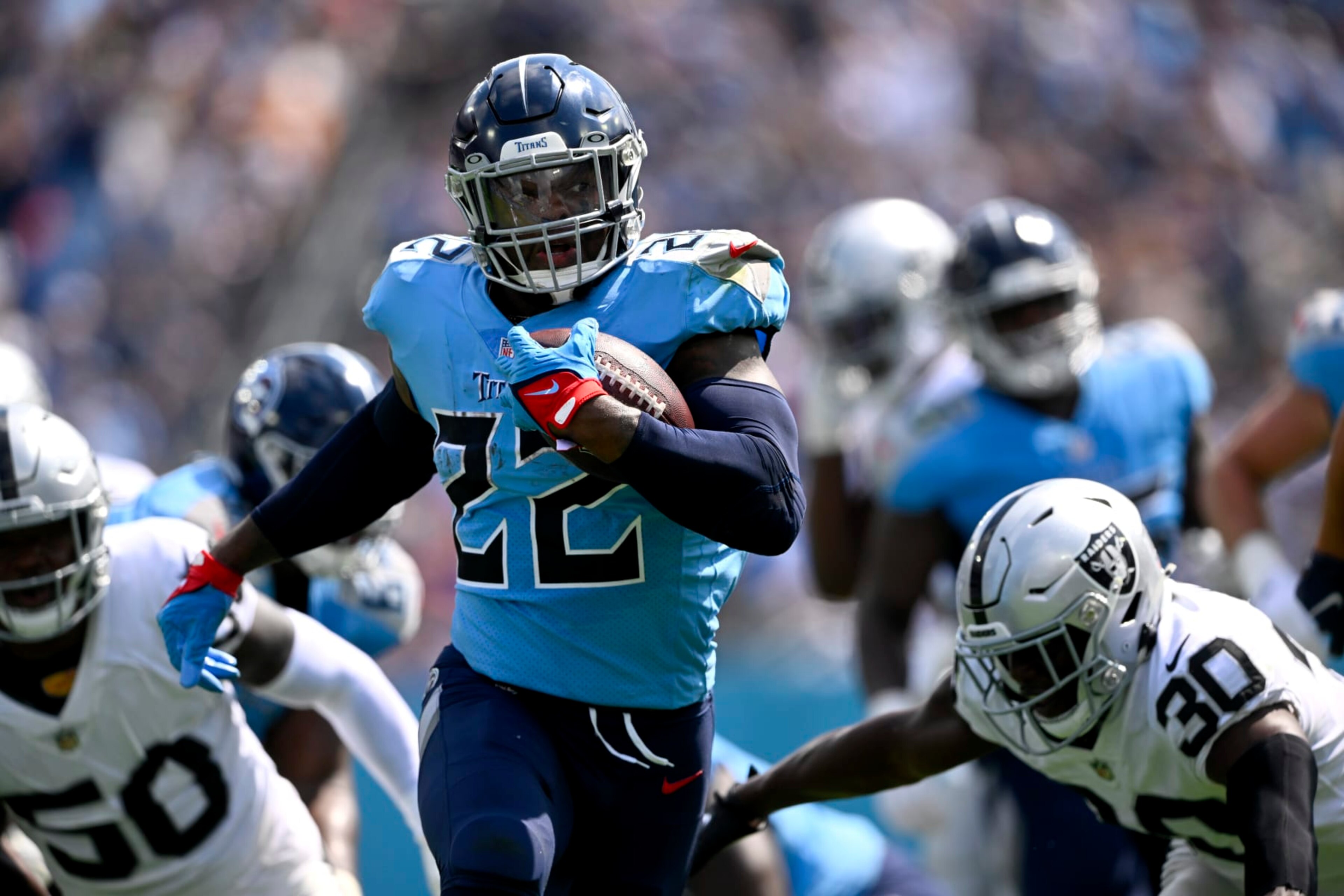 Tennessee Titans running back Derrick Henry (22) carries the ball against the Las Vegas Raiders in the first half of an NFL football game Sunday, Sept. 25, 2022, in Nashville, Tenn. (AP Photo/John Amis) Tennessee Titans running back Derrick Henry (22) carries the ball against the Las Vegas Raiders in the first half of an NFL football game Sunday, Sept. 25, 2022, in Nashville, Tenn. (AP Photo/John Amis)