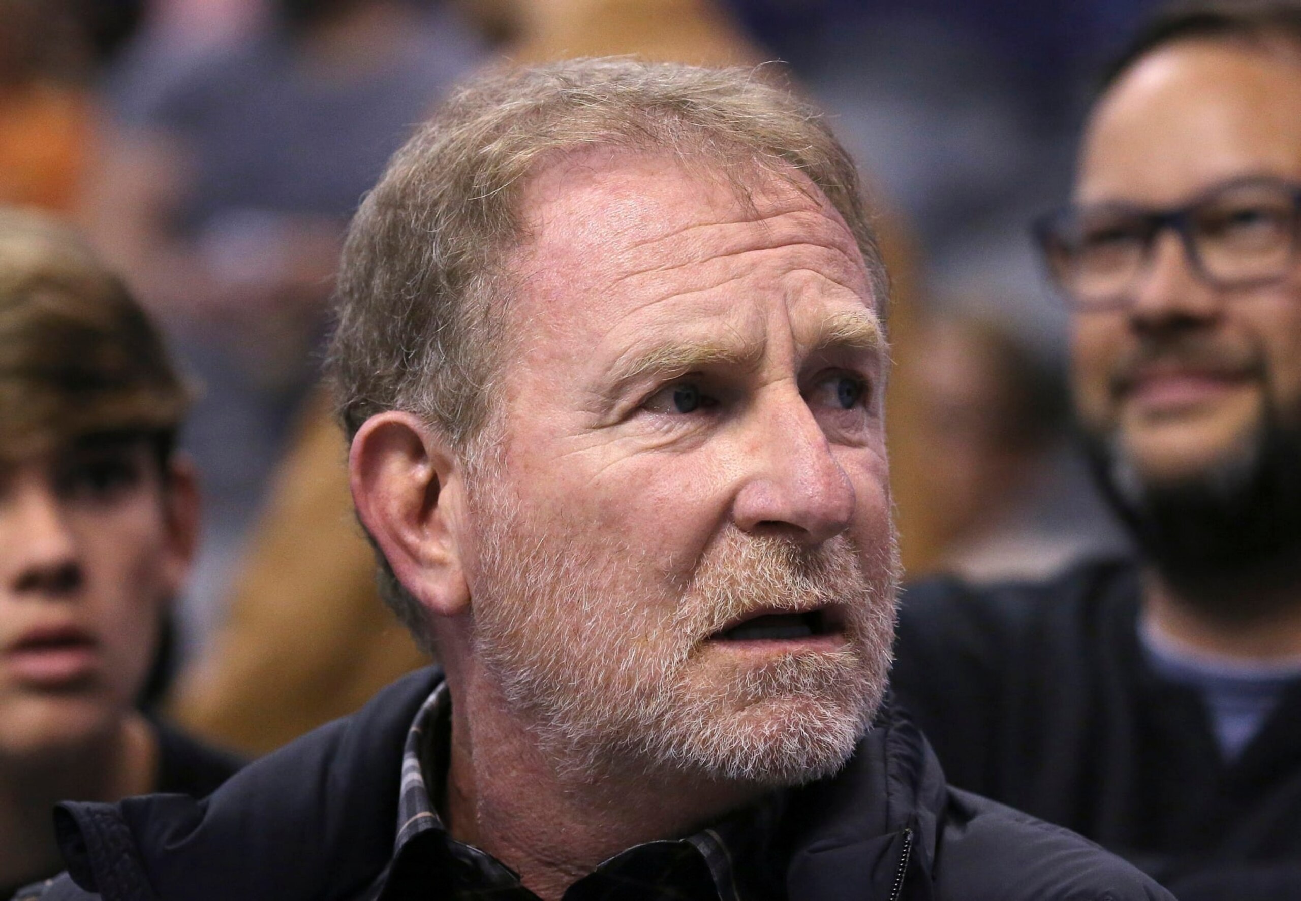 FILE - Phoenix Suns owner Robert Sarver watches the team play against the Memphis Grizzlies during the second half of an NBA basketball game in Phoenix, Dec. 11, 2019. The NBA has suspended Phoenix Suns and Phoenix Mercury owner Robert Sarver for one year, plus fined him $10 million, after an investigation found that he had engaged in what the league called “workplace misconduct and organizational deficiencies." The findings of the league's report, published Tuesday, Sept. 13, 2022, came nearly a year after the NBA asked a law firm to investigate allegations that Sarver had a history of racist, misogynistic and hostile incidents over his nearly two-decade tenure overseeing the franchise. (AP Photo/Ross D. Franklin, File)