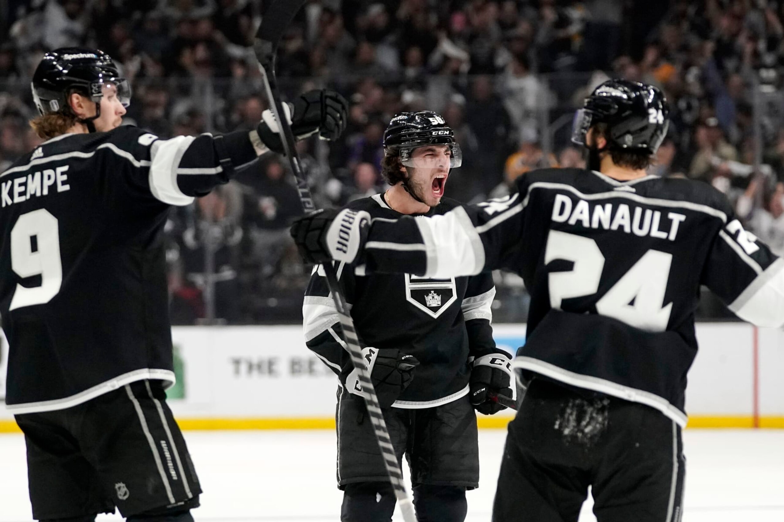 Los Angeles Kings defenseman Sean Durzi, center, celebrates his power play goal with center Adrian Kempe, left, and center Phillip Danault during the second period in Game 6 of an NHL hockey Stanley Cup first-round playoff series against the Edmonton Oilers Thursday, May 12, 2022, in Los Angeles. (AP Photo/Mark J. Terrill) Los Angeles Kings defenseman Sean Durzi, center, celebrates his power play goal with center Adrian Kempe, left, and center Phillip Danault during the second period in Game 6 of an NHL hockey Stanley Cup first-round playoff series against the Edmonton Oilers Thursday, May 12, 2022, in Los Angeles. (AP Photo/Mark J. Terrill)