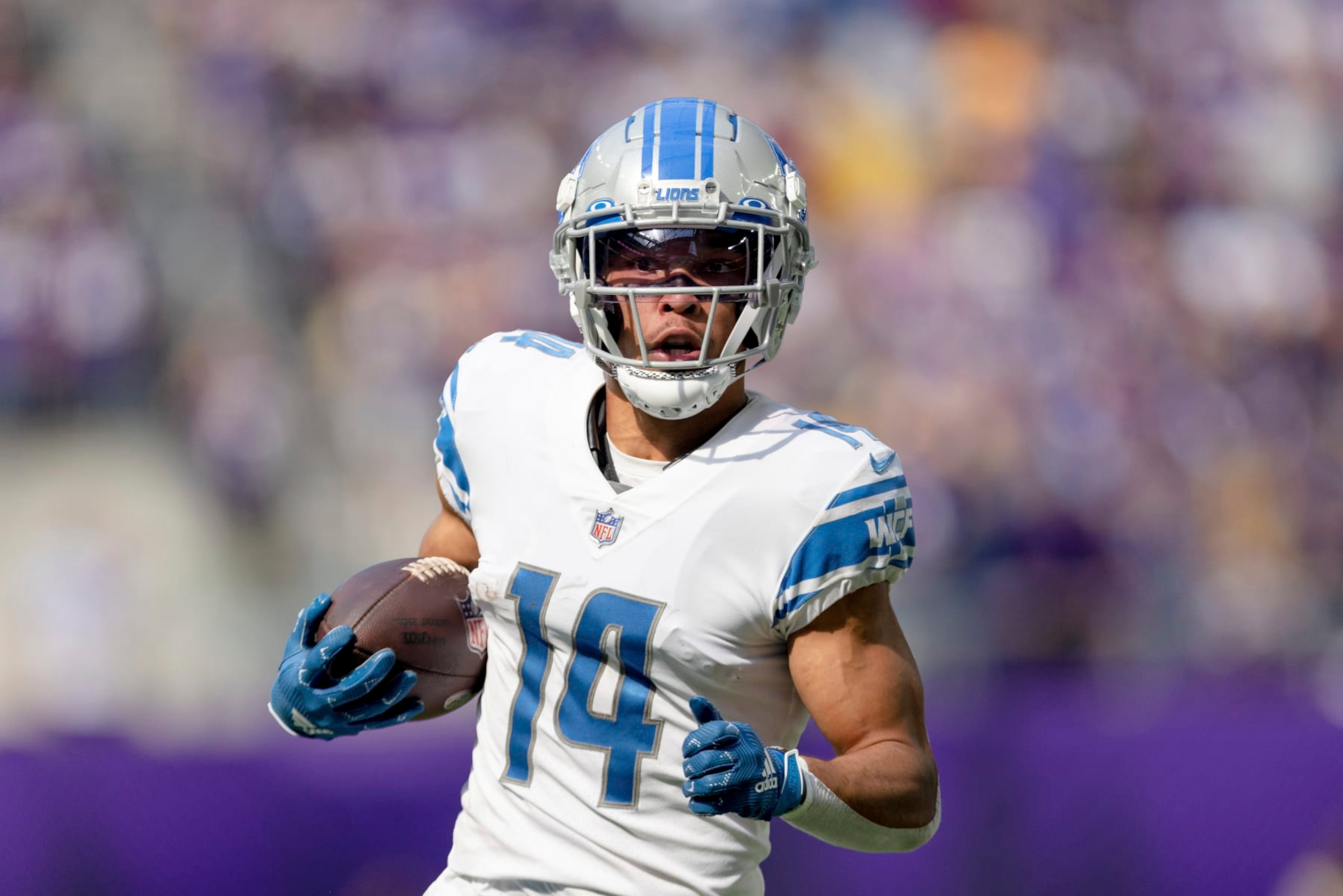 Detroit Lions wide receiver Amon-Ra St. Brown (14) carries the ball during the first half of an NFL football game against the Minnesota Vikings, Sunday, Sept. 25, 2022 in Minneapolis. (AP Photo/Stacy Bengs) Detroit Lions wide receiver Amon-Ra St. Brown (14) carries the ball during the first half of an NFL football game against the Minnesota Vikings, Sunday, Sept. 25, 2022 in Minneapolis. (AP Photo/Stacy Bengs)