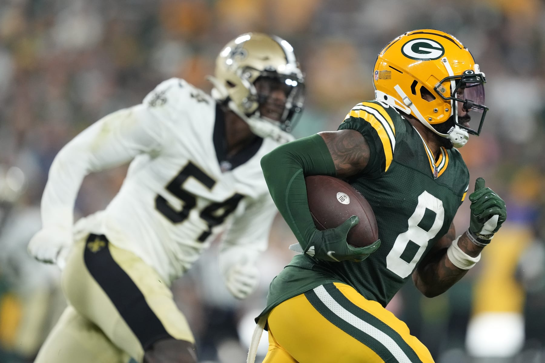 GREEN BAY, WISCONSIN - AUGUST 19: Amari Rodgers #8 of the Green Bay Packers returns a punt against the New Orleans Saints in the second half during a preseason game at Lambeau Field on August 19, 2022 in Green Bay, Wisconsin. (Photo by Patrick McDermott/Getty Images)