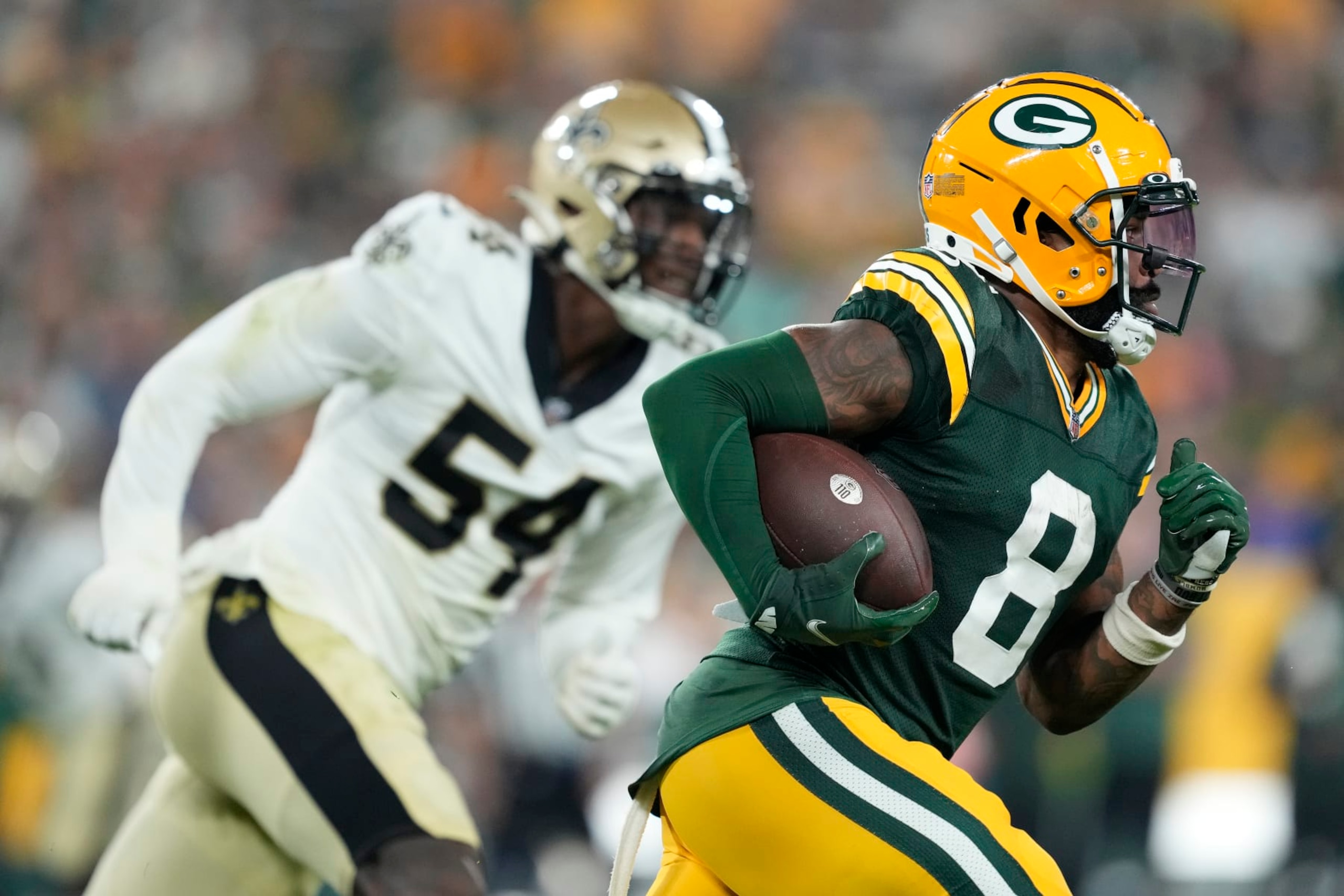 GREEN BAY, WISCONSIN - AUGUST 19: Amari Rodgers #8 of the Green Bay Packers returns a punt against the New Orleans Saints in the second half during a preseason game at Lambeau Field on August 19, 2022 in Green Bay, Wisconsin. (Photo by Patrick McDermott/Getty Images)