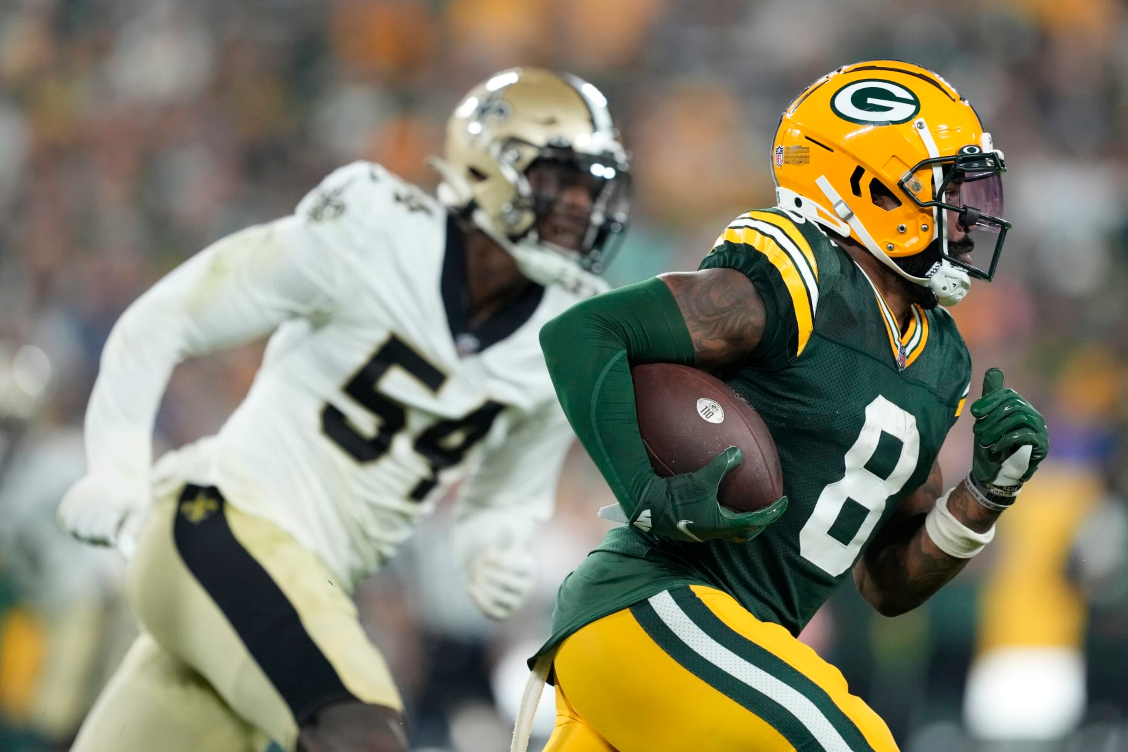 GREEN BAY, WISCONSIN - AUGUST 19: Amari Rodgers #8 of the Green Bay Packers returns a punt against the New Orleans Saints in the second half during a preseason game at Lambeau Field on August 19, 2022 in Green Bay, Wisconsin. (Photo by Patrick McDermott/Getty Images)