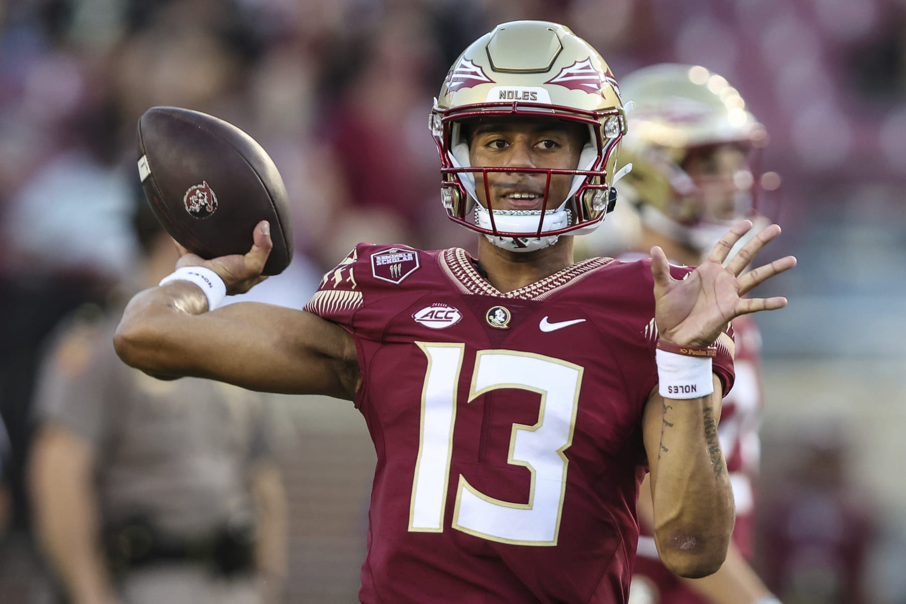 Florida State quarterback Jordan Travis (13) warms up before an NCAA college football game against Boston College on Saturday, Sept. 24, 2022, in Tallahassee, Fla. (AP Photo/Gary McCullough)