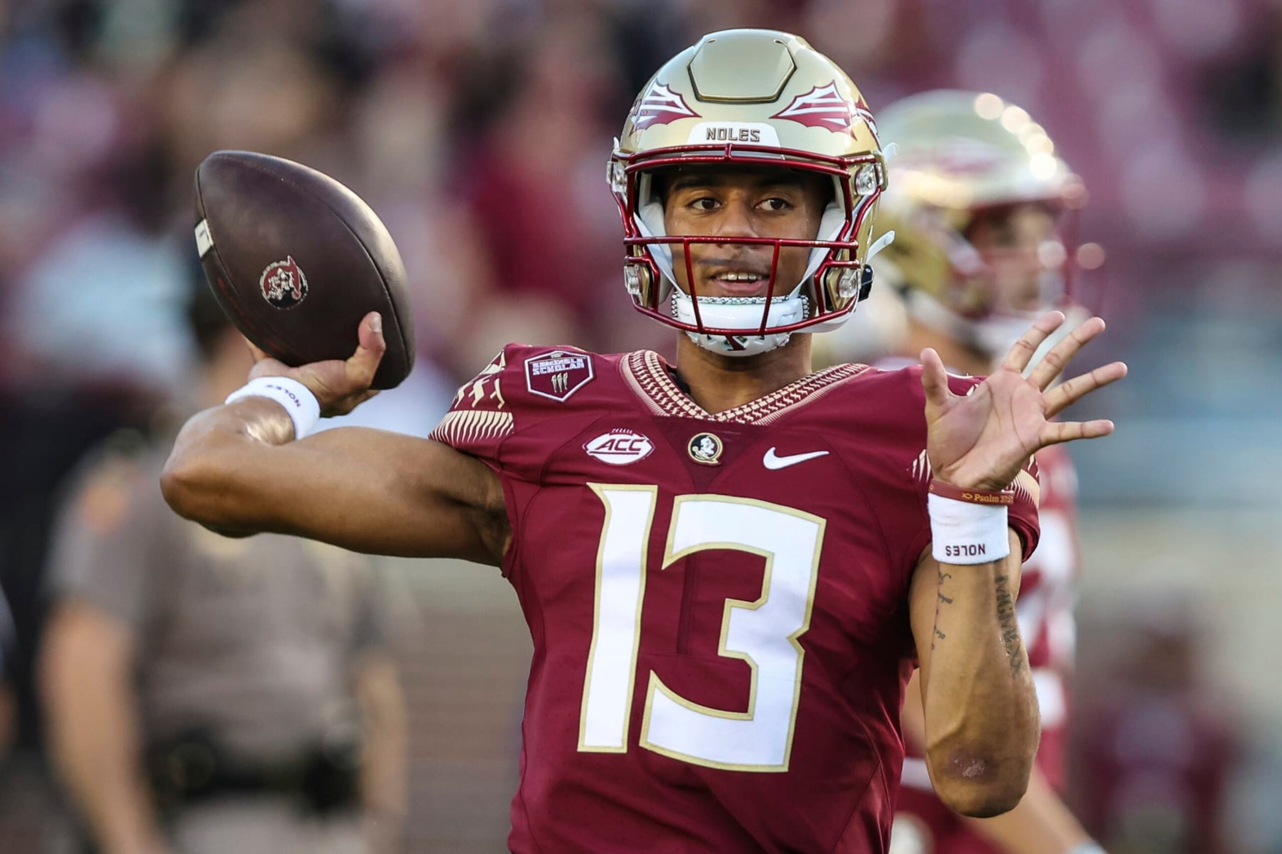 Florida State quarterback Jordan Travis (13) warms up before an NCAA college football game against Boston College on Saturday, Sept. 24, 2022, in Tallahassee, Fla. (AP Photo/Gary McCullough)