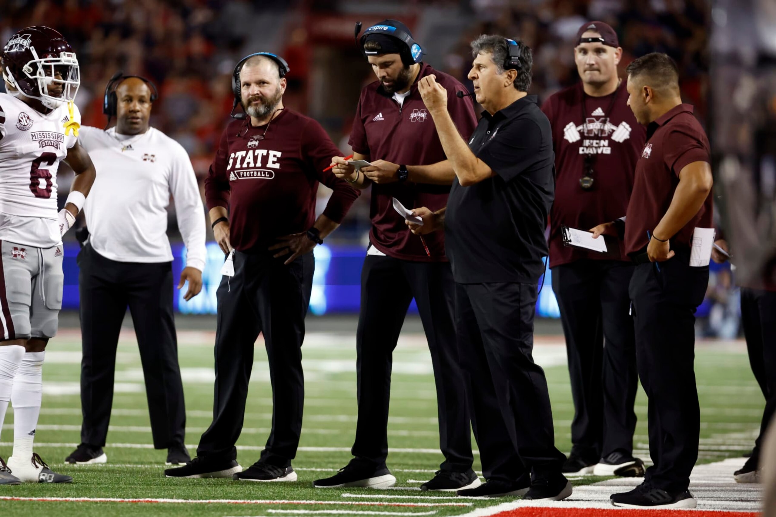 Mississippi State head coach Mike Leach, center, calls a play in the first half against Arizona during an NCAA college football game, Saturday, Sept. 10, 2022, in Tucson, Ariz. (AP Photo/Chris Coduto)