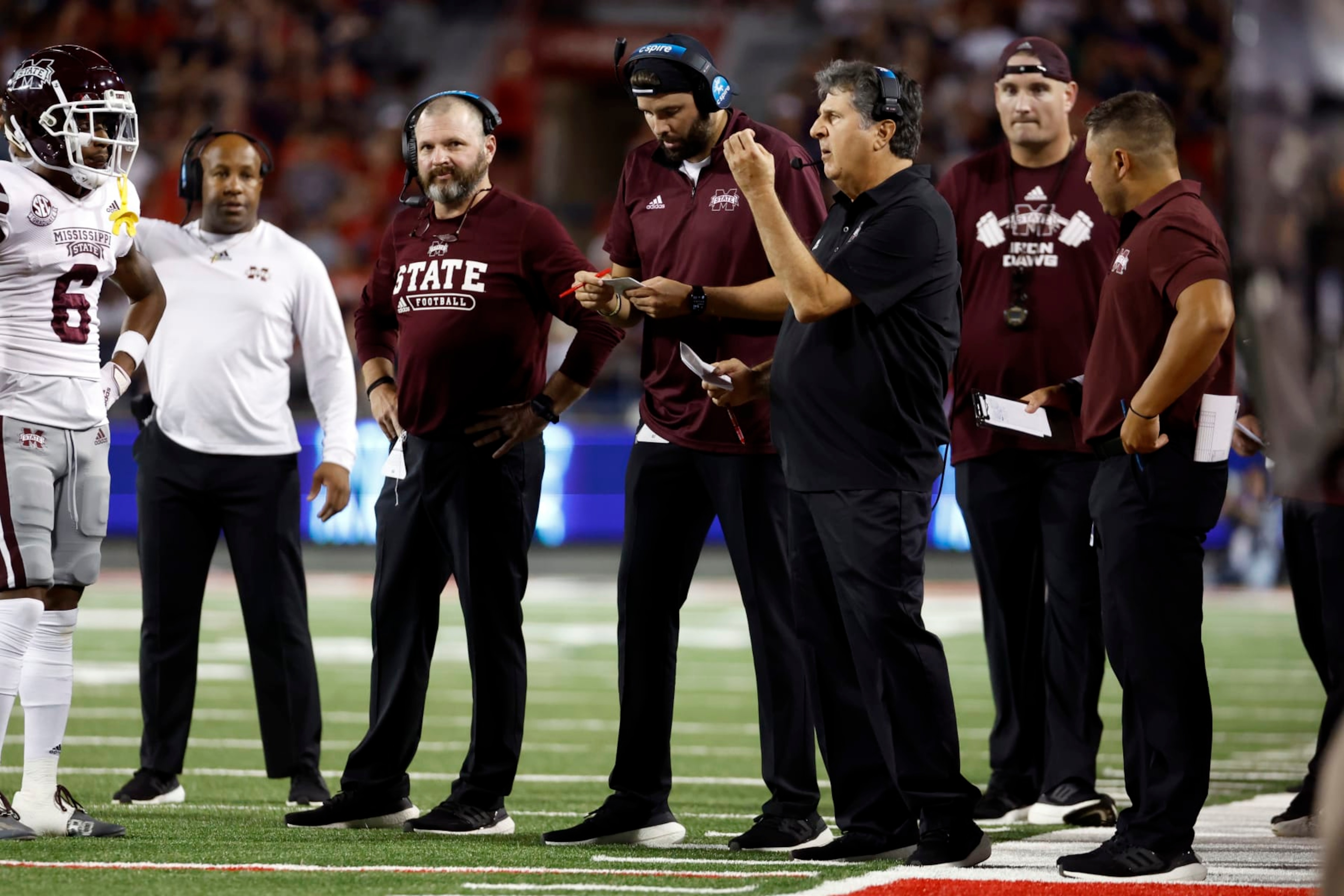 Mississippi State head coach Mike Leach, center, calls a play in the first half against Arizona during an NCAA college football game, Saturday, Sept. 10, 2022, in Tucson, Ariz. (AP Photo/Chris Coduto)