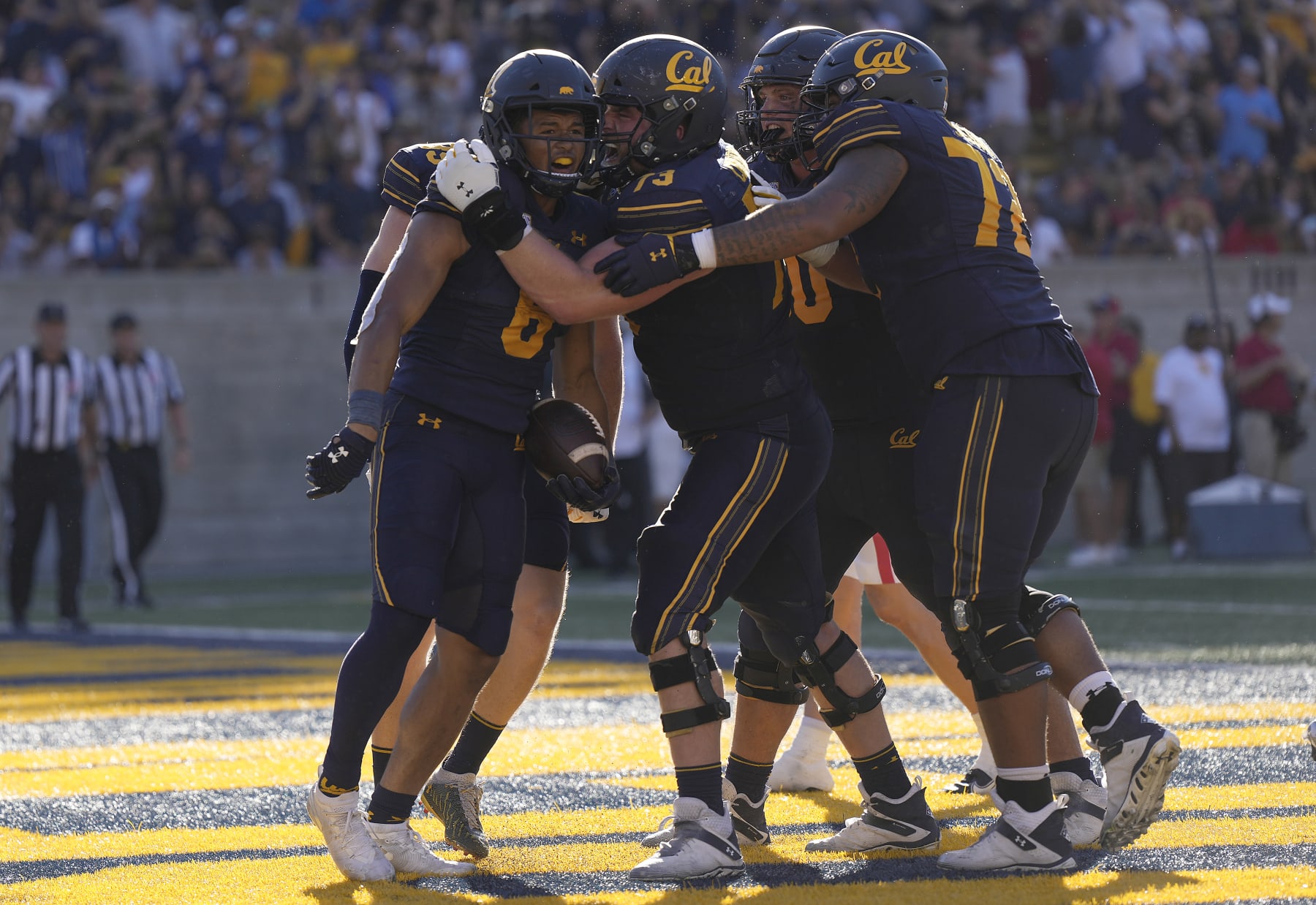 BERKELEY, CALIFORNIA - SEPTEMBER 24: Running back Jaydn Ott #6 of the California Golden Bears celebrates with teammates after he scored a touchdown against the Arizona Wildcats in the third quarter at FTX  Field at California Memorial Stadium on September 24, 2022 in Berkeley, California. The Golden Bears won the game 49-31. (Photo by Thearon W. Henderson/Getty Images)