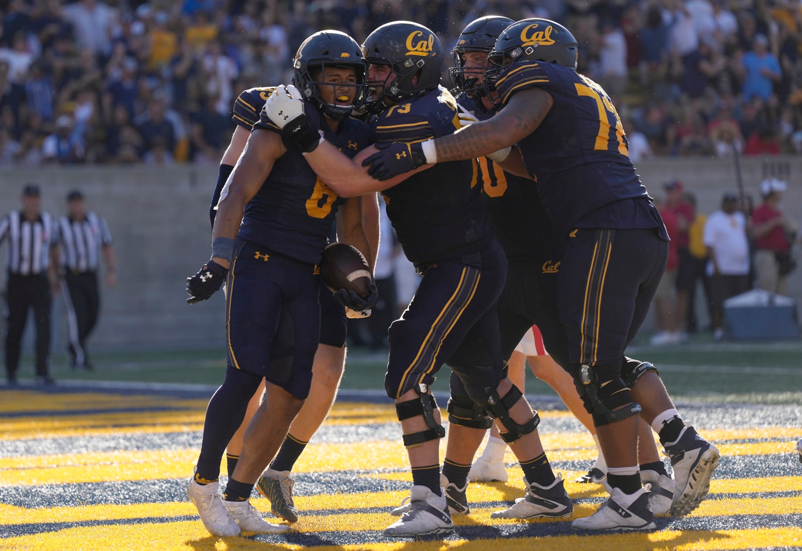 BERKELEY, CALIFORNIA - SEPTEMBER 24: Running back Jaydn Ott #6 of the California Golden Bears celebrates with teammates after he scored a touchdown against the Arizona Wildcats in the third quarter at FTX  Field at California Memorial Stadium on September 24, 2022 in Berkeley, California. The Golden Bears won the game 49-31. (Photo by Thearon W. Henderson/Getty Images)