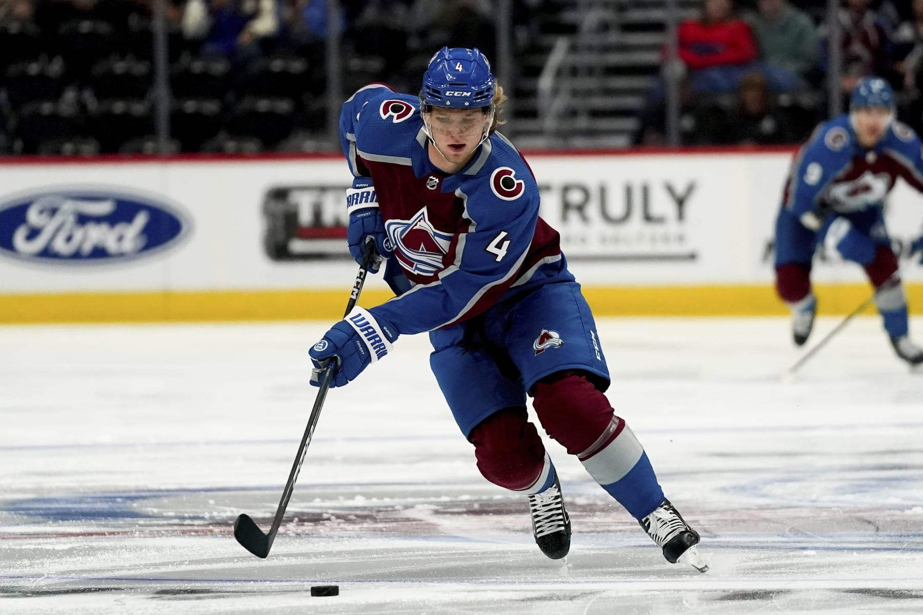 Colorado Avalanche defenseman Bowen Byram skates against the Vegas Golden Knights in the first period of an NHL preseason hockey game Sunday, Sept. 25, 2022, in Denver. (AP Photo/Geneva Heffernan)