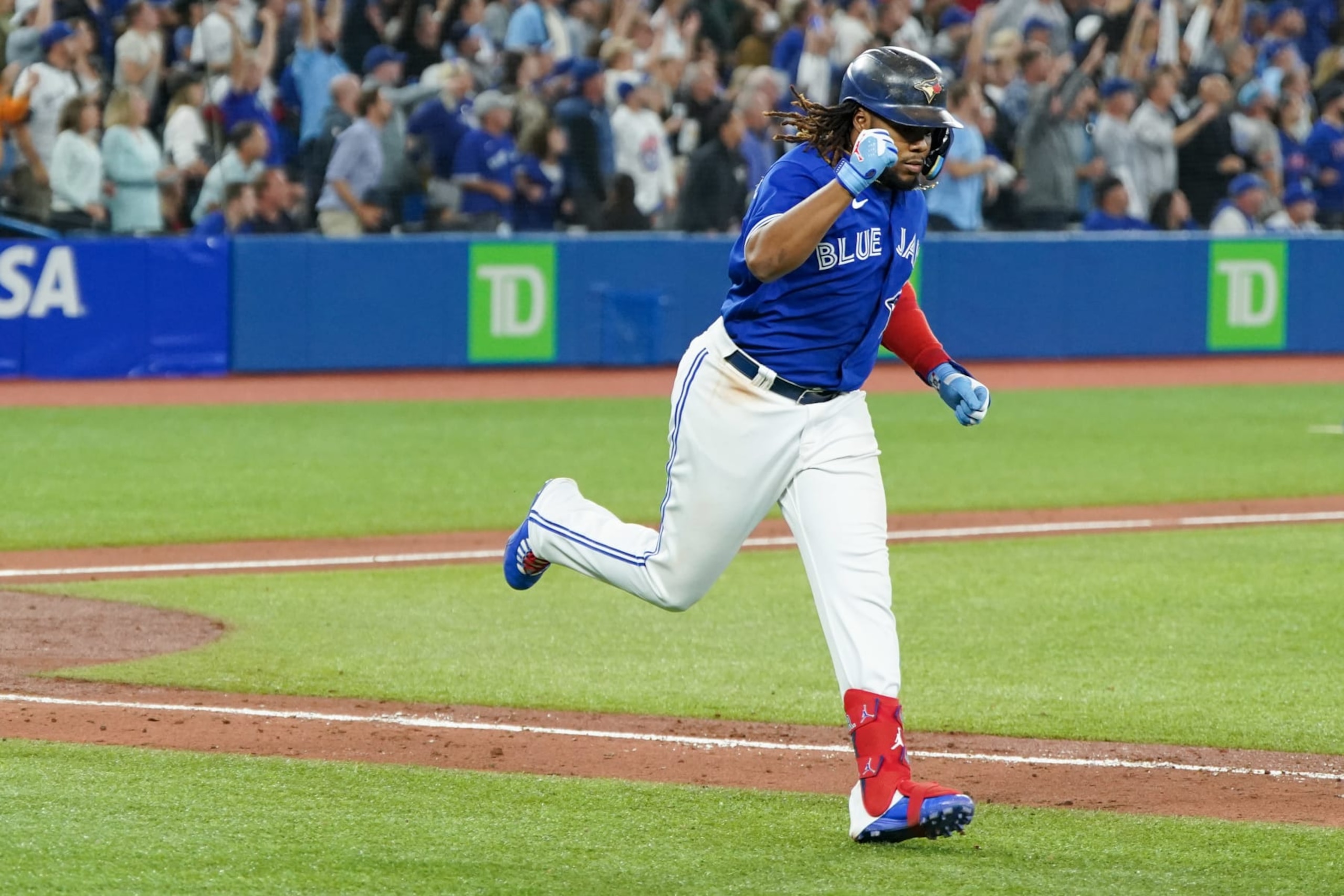TORONTO, - SEPTEMBER 28: Vladimir Guerrero Jr. #27 of the Toronto Blue Jays hits a sacrifice fly in the sixth inning during the game between the New York Yankees and the Toronto Blue Jays at Rogers Centre on Wednesday, September 28, 2022 in Toronto, Canada. (Photo by Thomas Skrlj/MLB Photos via Getty Images) TORONTO, - SEPTEMBER 28: Vladimir Guerrero Jr. #27 of the Toronto Blue Jays hits a sacrifice fly in the sixth inning during the game between the New York Yankees and the Toronto Blue Jays at Rogers Centre on Wednesday, September 28, 2022 in Toronto, Canada. (Photo by Thomas Skrlj/MLB Photos via Getty Images)
