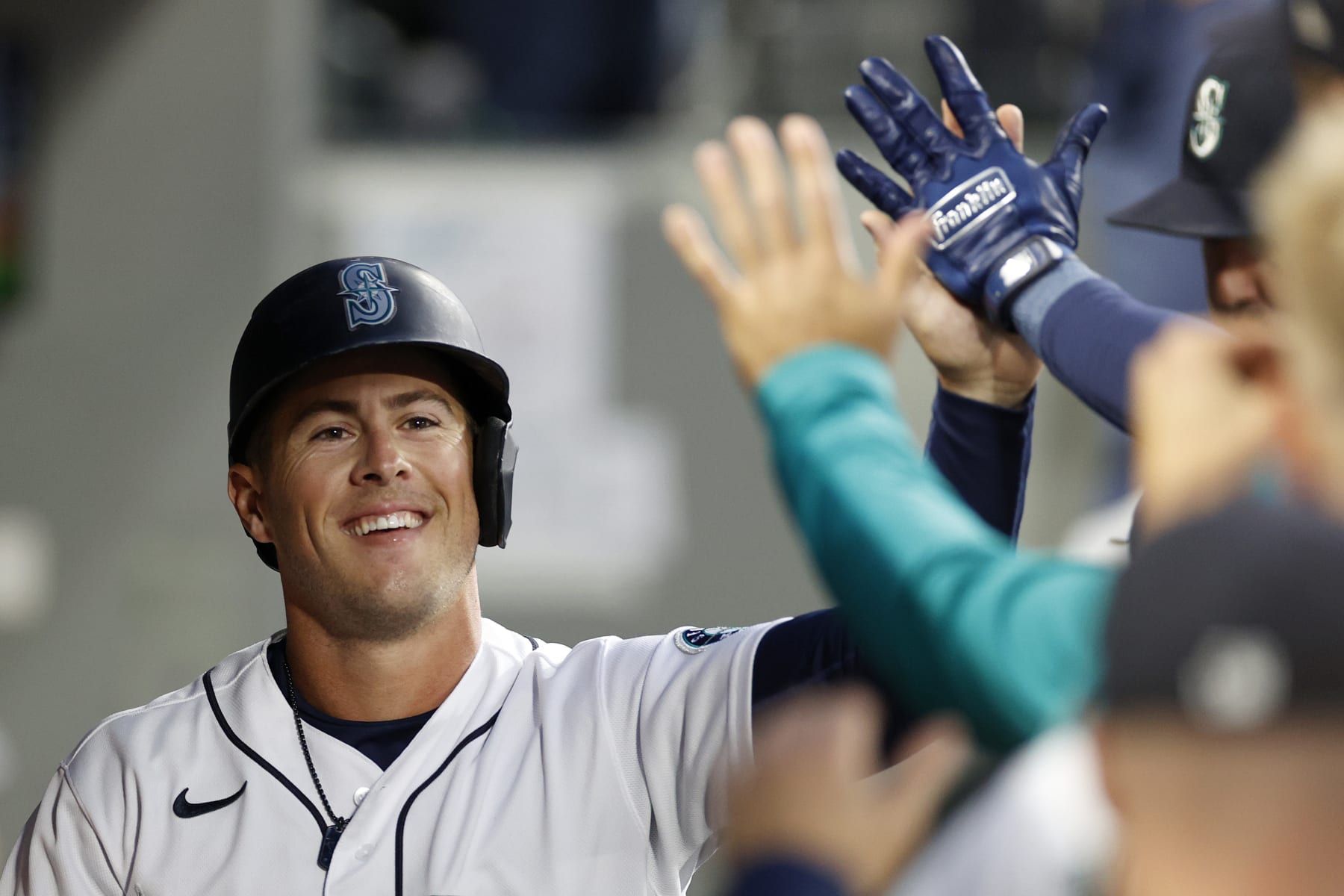 SEATTLE, WASHINGTON - SEPTEMBER 28: Dylan Moore #25 of the Seattle Mariners reacts after scoring a run during the first inning against the Texas Rangers at T-Mobile Park on September 28, 2022 in Seattle, Washington. (Photo by Steph Chambers/Getty Images)