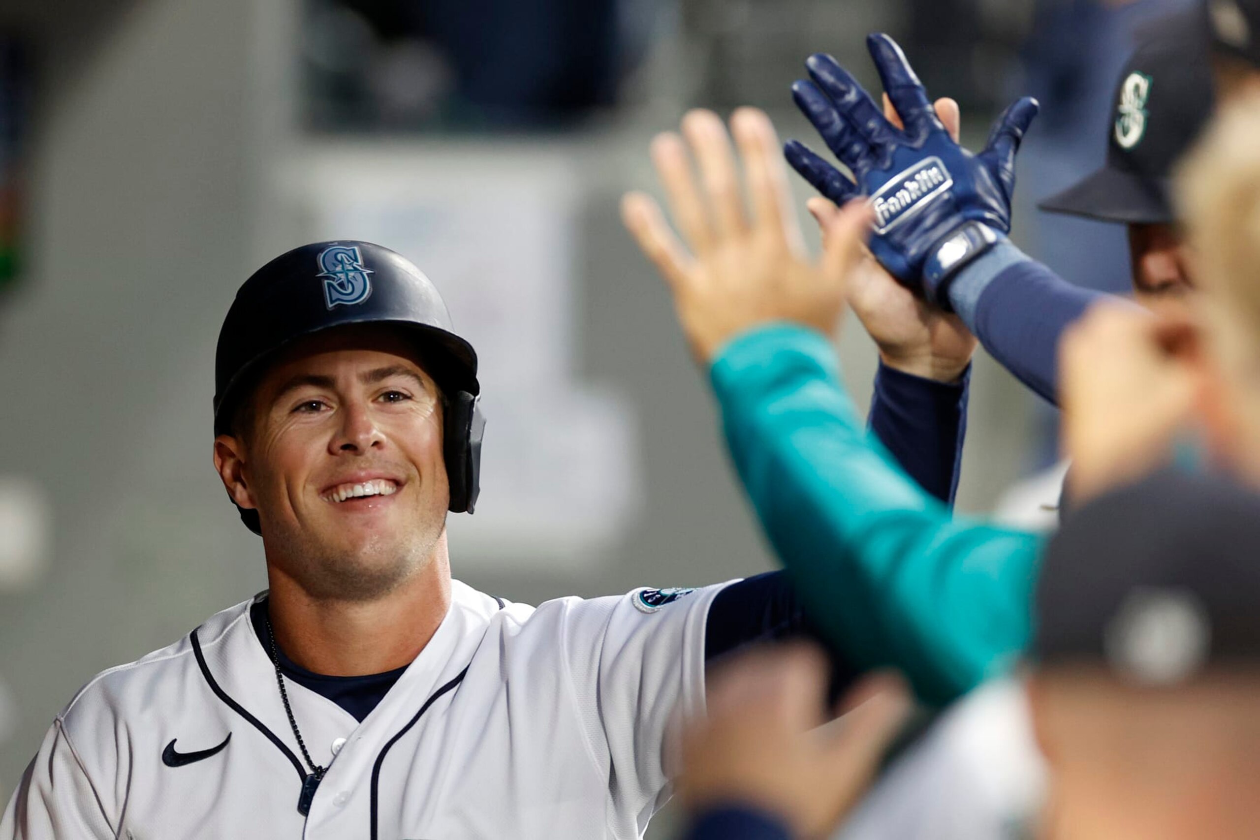 SEATTLE, WASHINGTON - SEPTEMBER 28: Dylan Moore #25 of the Seattle Mariners reacts after scoring a run during the first inning against the Texas Rangers at T-Mobile Park on September 28, 2022 in Seattle, Washington. (Photo by Steph Chambers/Getty Images) SEATTLE, WASHINGTON - SEPTEMBER 28: Dylan Moore #25 of the Seattle Mariners reacts after scoring a run during the first inning against the Texas Rangers at T-Mobile Park on September 28, 2022 in Seattle, Washington. (Photo by Steph Chambers/Getty Images)