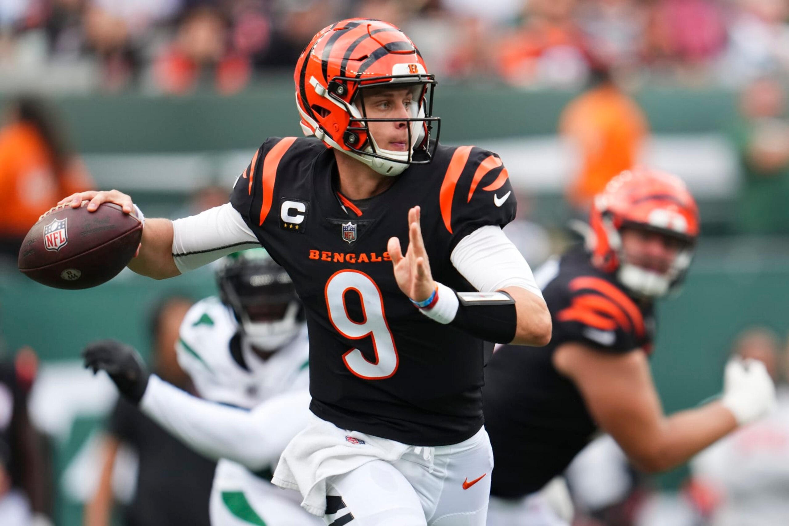 EAST RUTHERFORD, NJ - SEPTEMBER 25: Joe Burrow #9 of the Cincinnati Bengals throws the ball against the New York Jets at MetLife Stadium on September 25, 2022 in East Rutherford, New Jersey. (Photo by Cooper Neill/Getty Images)