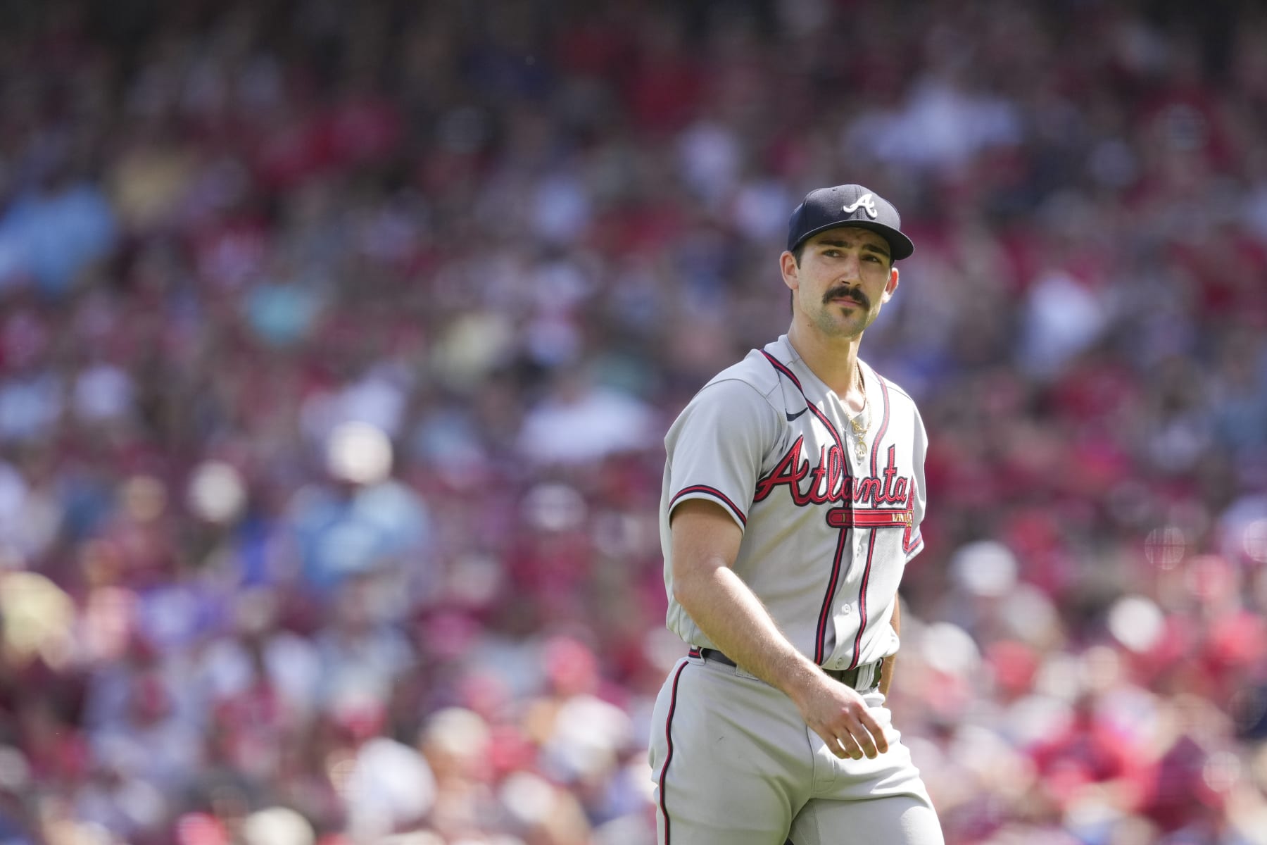 Atlanta Braves starting pitcher Spencer Strider (65) plays during the first inning of the team's baseball game against the Cincinnati Reds Saturday, July 2, 2022, in Cincinnati. (AP Photo/Jeff Dean)