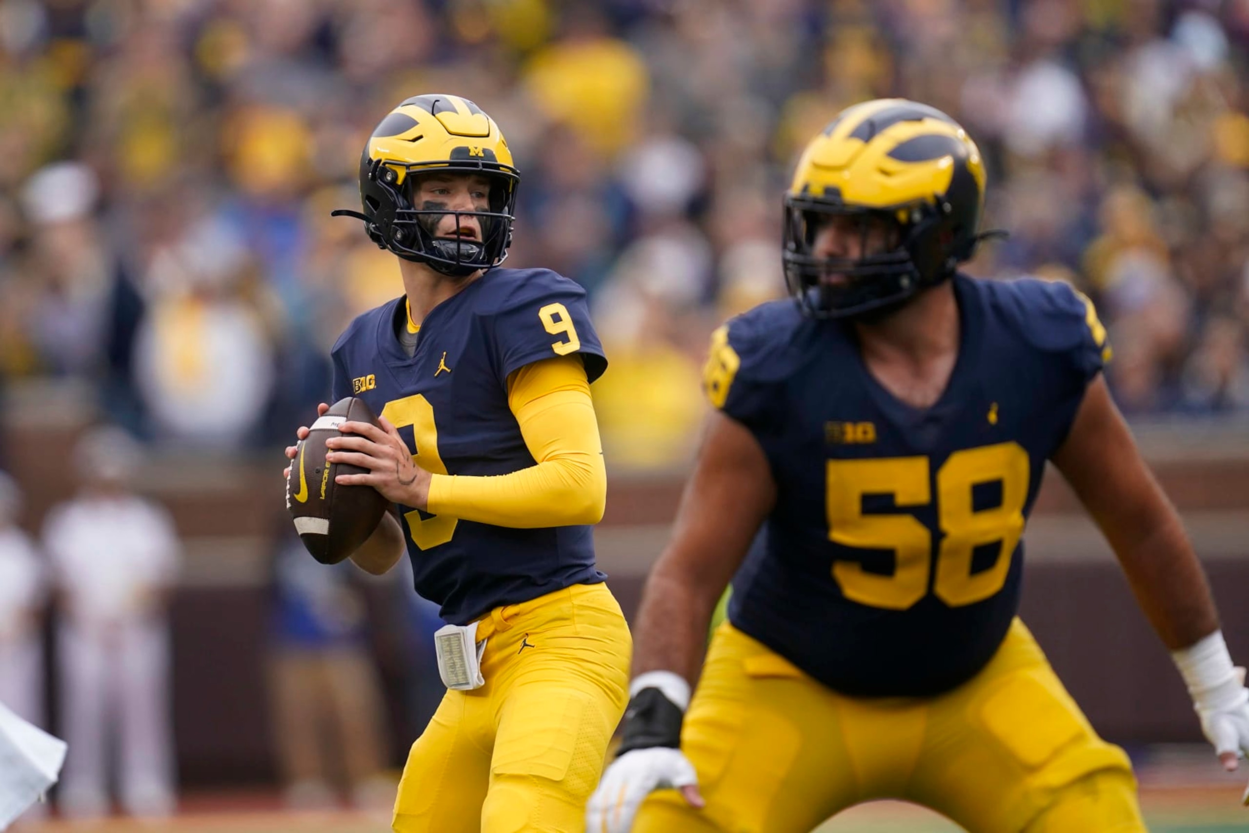 Michigan quarterback J.J. McCarthy (9) looks to throw against Maryland in the second half of an NCAA college football game in Ann Arbor, Mich., Saturday, Sept. 24, 2022. (AP Photo/Paul Sancya)