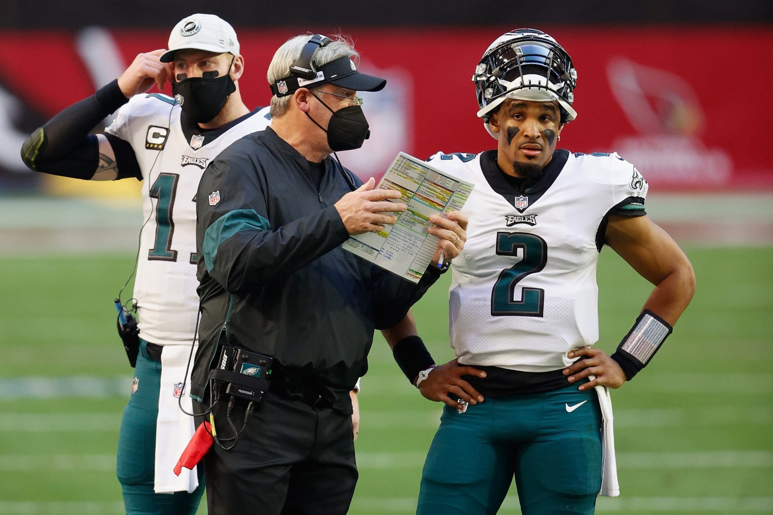 GLENDALE, ARIZONA - DECEMBER 20: Head coach Doug Pederson of the Philadelphia Eagles talks with quarterback Jalen Hurts #2 during the NFL game against the Arizona Cardinals at State Farm Stadium on December 20, 2020 in Glendale, Arizona. The Cardinals defeated the Eagles 33-26. (Photo by Christian Petersen/Getty Images)