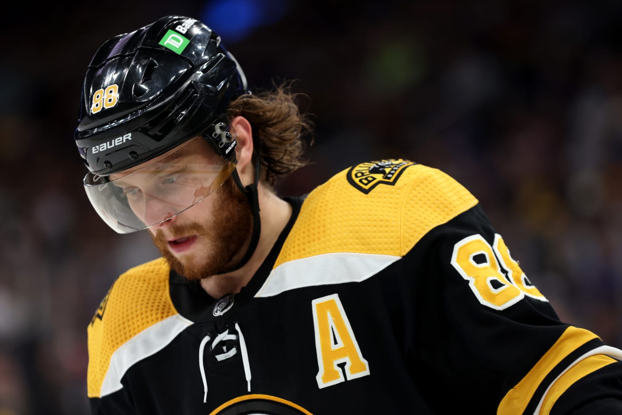 BOSTON, MASSACHUSETTS - APRIL 23: David Pastrnak #88 of the Boston Bruins looks on during the third period against the New York Rangers at TD Garden on April 23, 2022 in Boston, Massachusetts. The Bruins defeat the Rangers 3-1.  (Photo by Maddie Meyer/Getty Images)
