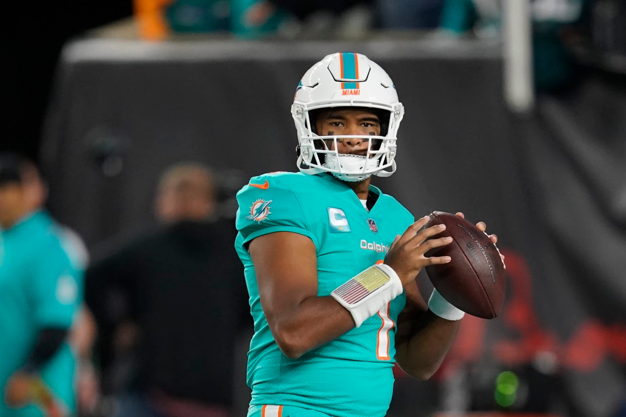 Miami Dolphins quarterback Tua Tagovailoa throws before an NFL football game against the Cincinnati Bengals, Thursday, Sept. 29, 2022, in Cincinnati. (AP Photo/Joshua A. Bickel)
