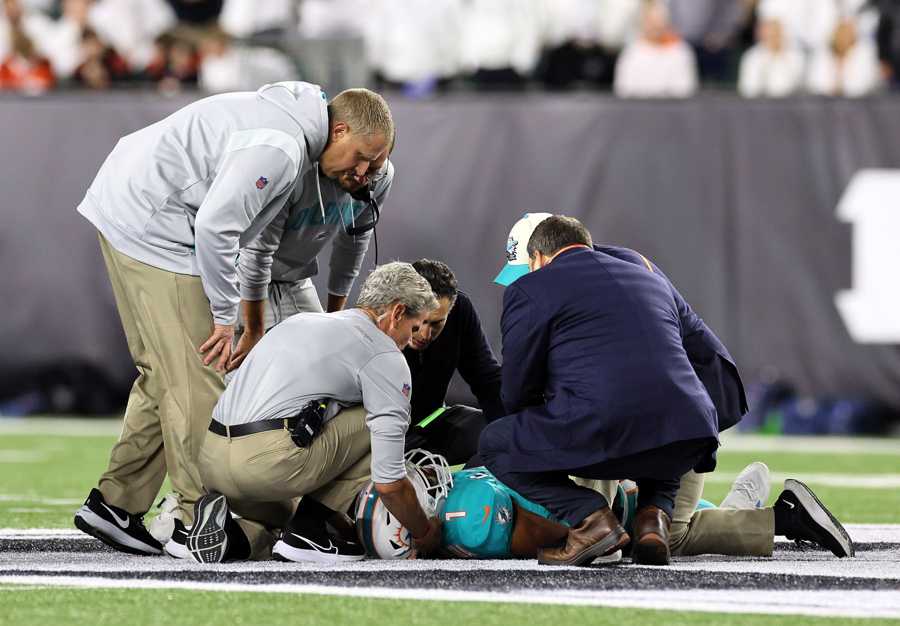 CINCINNATI, OHIO - SEPTEMBER 29:  Medical staff tend to quarterback Tua Tagovailoa #1 of the Miami Dolphins after an injury during the 2nd quarter of the game against the Cincinnati Bengals at Paycor Stadium on September 29, 2022 in Cincinnati, Ohio. (Photo by Andy Lyons/Getty Images)