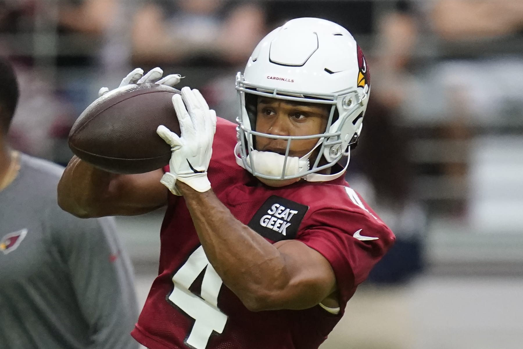 Arizona Cardinals wide receiver Rondale Moore reaches out to make a catch as he takes part in drills during the NFL football team's training camp at State Farm Stadium, Saturday, July 30, 2022, in Glendale, Ariz. (AP Photo/Ross D. Franklin)