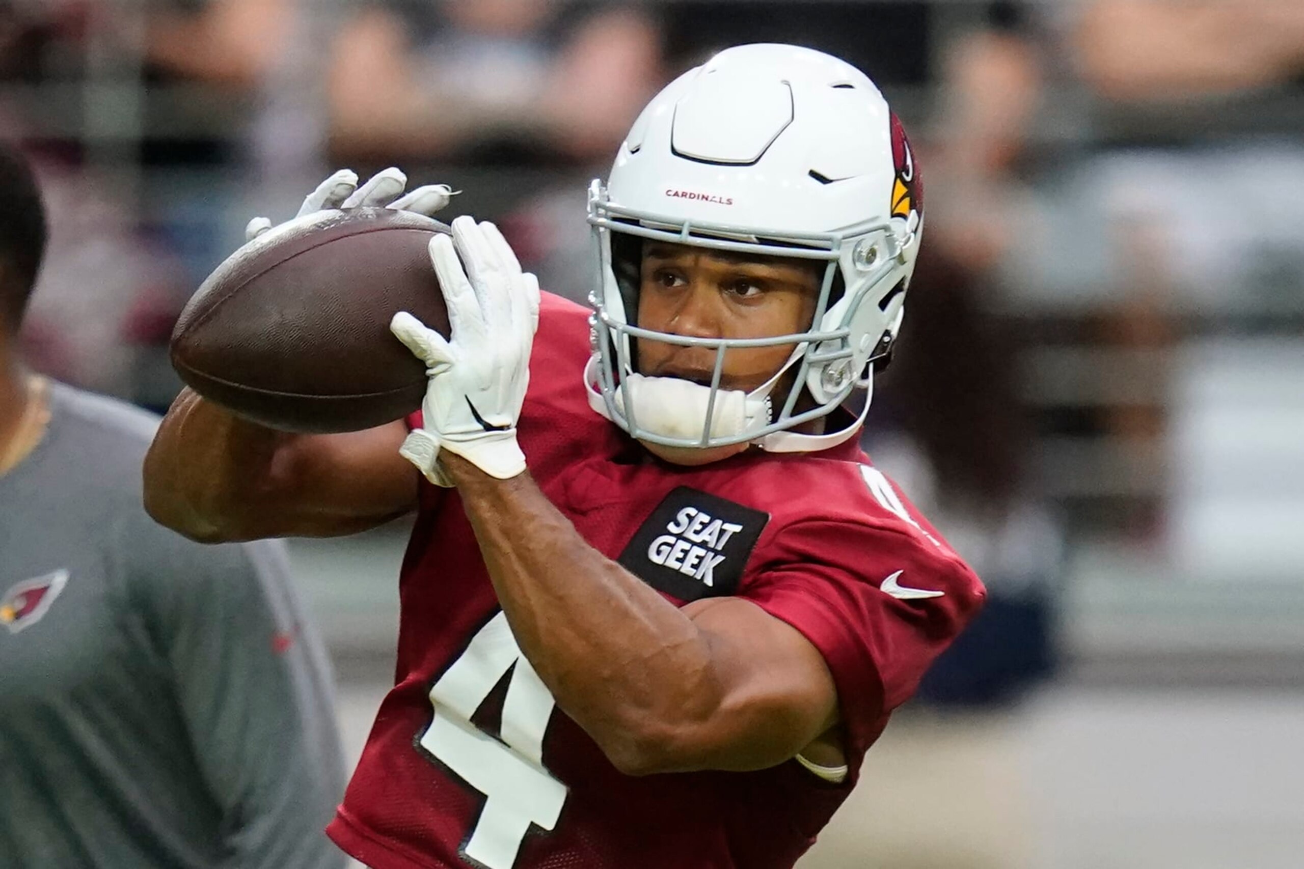 Arizona Cardinals wide receiver Rondale Moore reaches out to make a catch as he takes part in drills during the NFL football team's training camp at State Farm Stadium, Saturday, July 30, 2022, in Glendale, Ariz. (AP Photo/Ross D. Franklin)