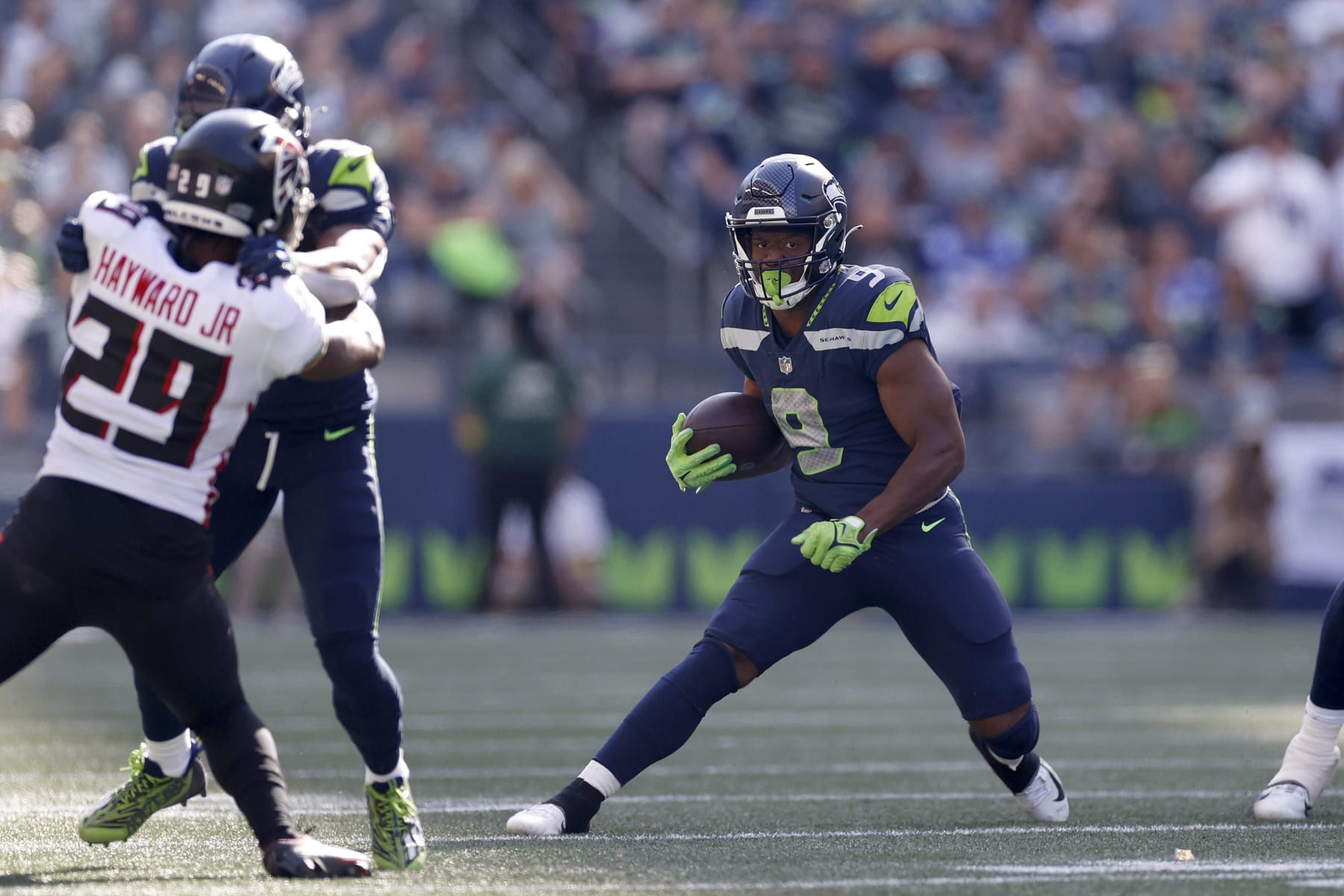 SEATTLE, WASHINGTON - SEPTEMBER 25: Kenneth Walker III #9 of the Seattle Seahawks carries the ball against the Atlanta Falcons during the third quarter at Lumen Field on September 25, 2022 in Seattle, Washington. (Photo by Steph Chambers/Getty Images)
