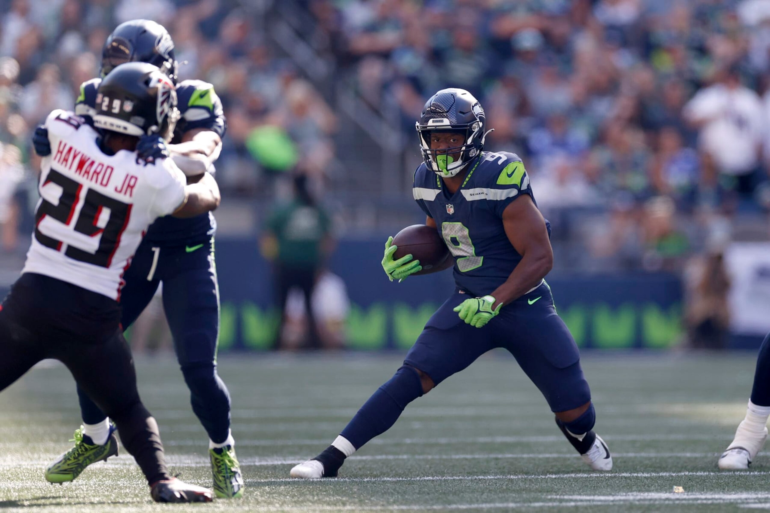 SEATTLE, WASHINGTON - SEPTEMBER 25: Kenneth Walker III #9 of the Seattle Seahawks carries the ball against the Atlanta Falcons during the third quarter at Lumen Field on September 25, 2022 in Seattle, Washington. (Photo by Steph Chambers/Getty Images)