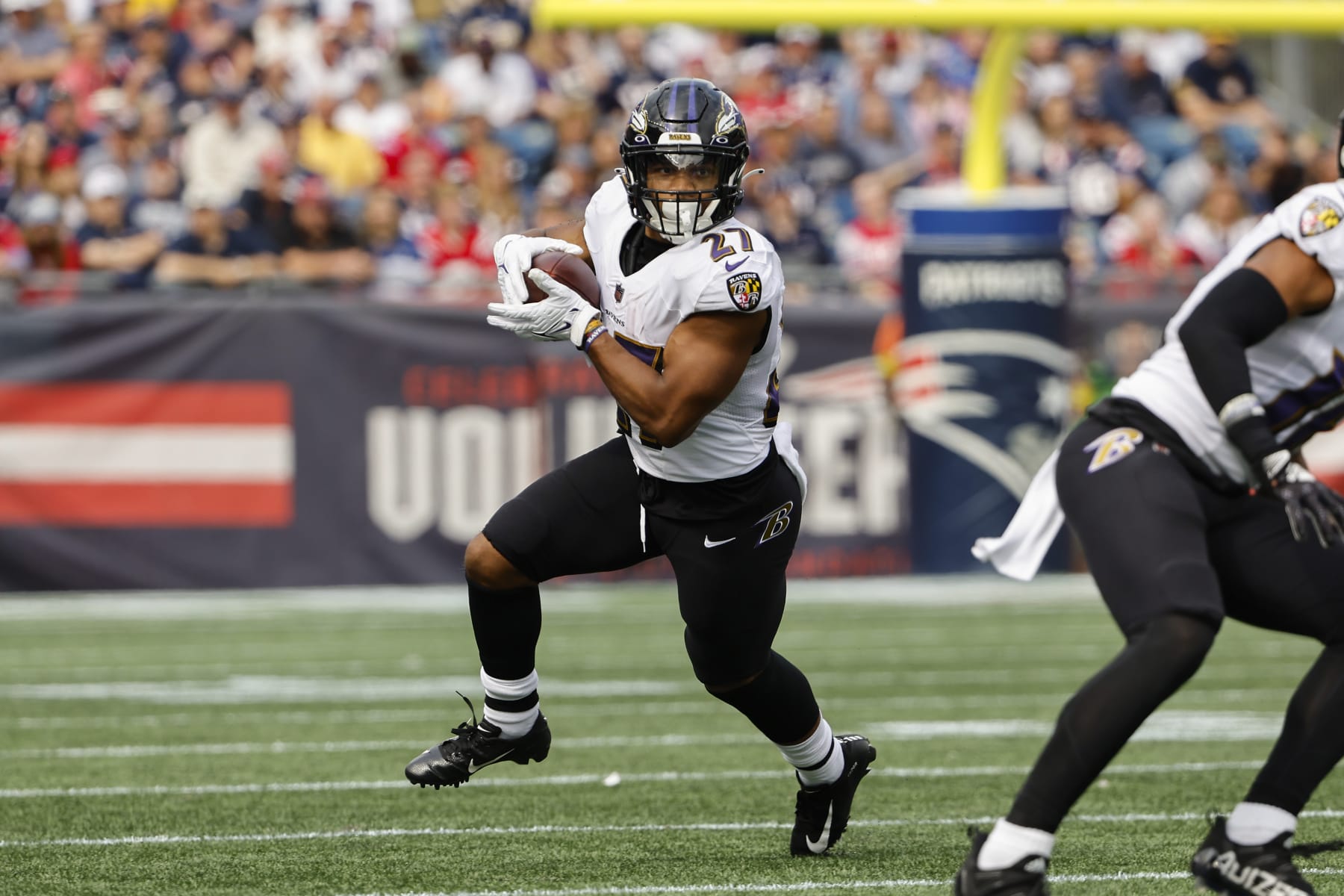 Baltimore Ravens' J.K. Dobbins runs against the New England Patriots during an NFL football game at Gillette Stadium, Sunday, Sunday, Sept. 24, 2022 in Foxborough, Mass. (Winslow Townson/AP Images for Panini)