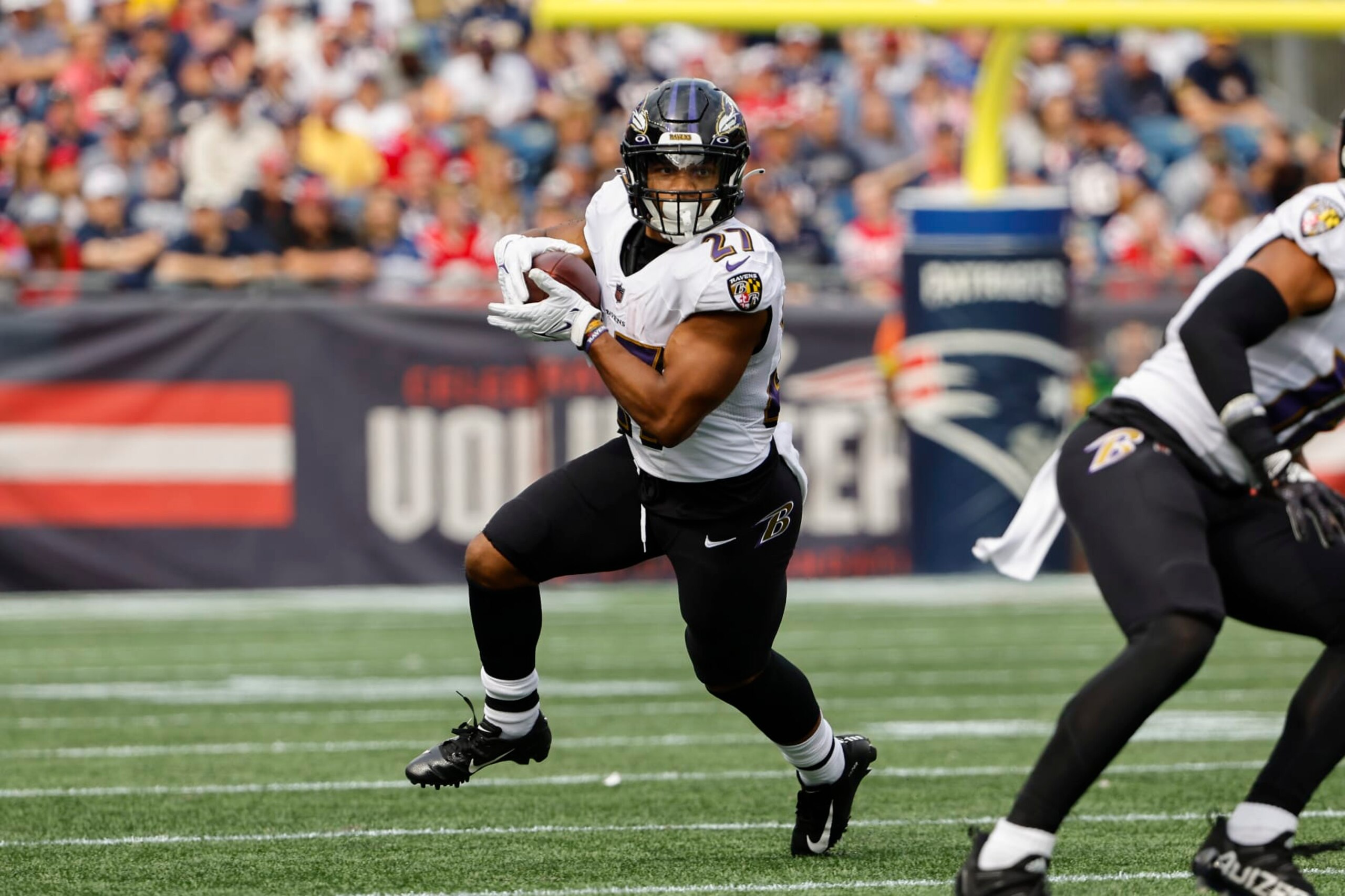 Baltimore Ravens' J.K. Dobbins runs against the New England Patriots during an NFL football game at Gillette Stadium, Sunday, Sunday, Sept. 24, 2022 in Foxborough, Mass. (Winslow Townson/AP Images for Panini)