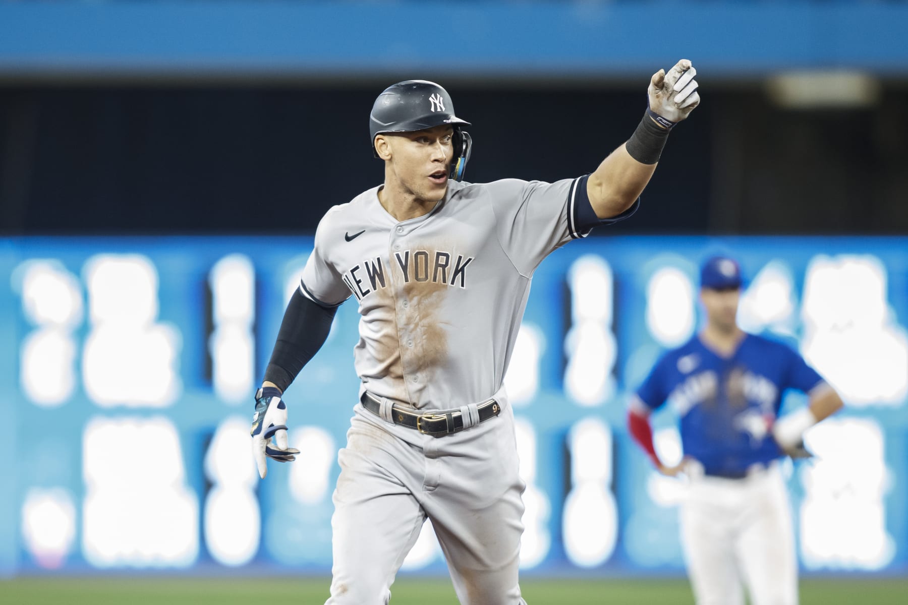 TORONTO, ON - SEPTEMBER 28:  Aaron Judge #99 of the New York Yankees runs out his 61st home run of the season in the seventh inning against the Toronto Blue Jays at Rogers Centre on September 28, 2022 in Toronto, Ontario, Canada. Judge has now tied Roger Maris for the American League record.  (Photo by Cole Burston/Getty Images)
