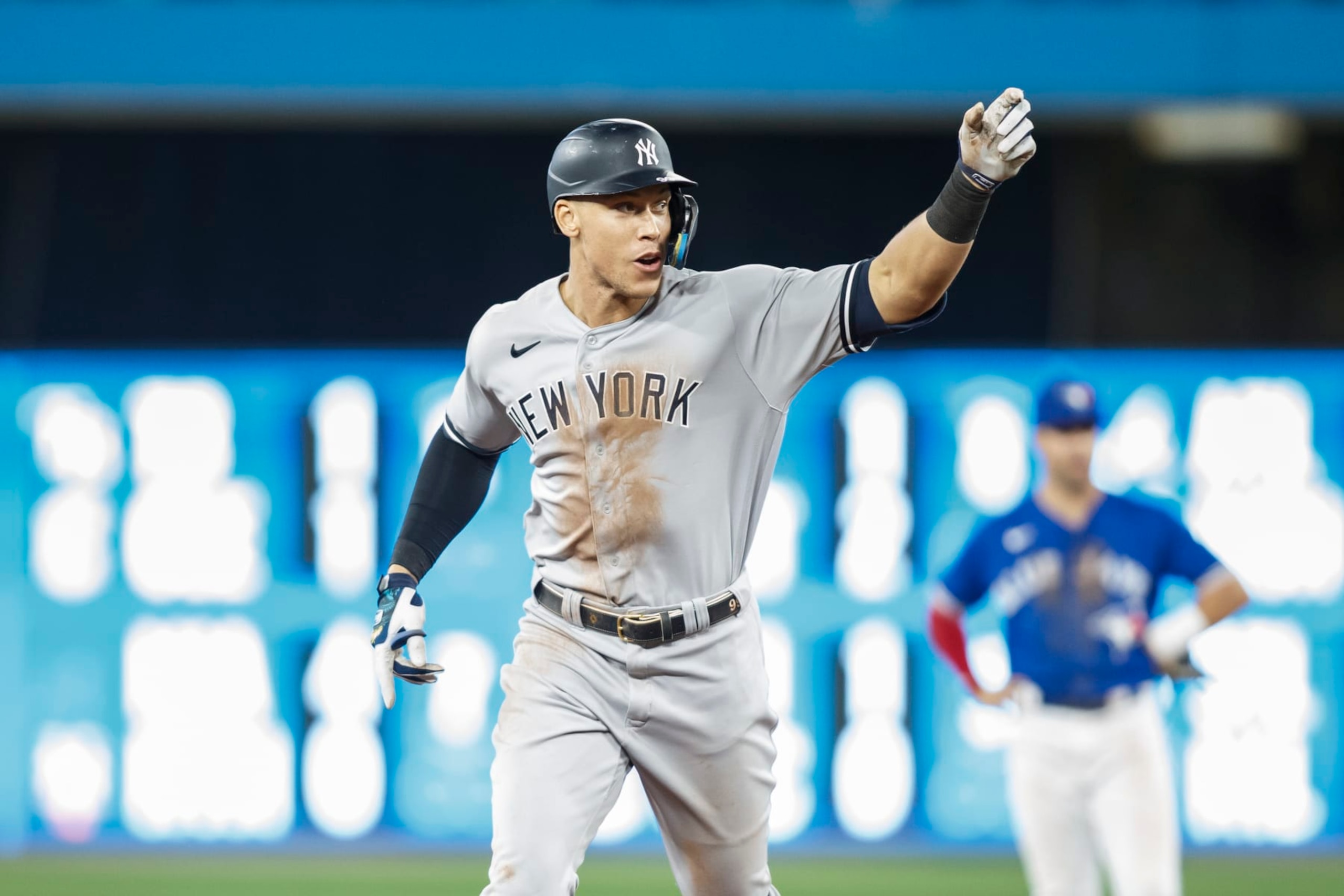 TORONTO, ON - SEPTEMBER 28:  Aaron Judge #99 of the New York Yankees runs out his 61st home run of the season in the seventh inning against the Toronto Blue Jays at Rogers Centre on September 28, 2022 in Toronto, Ontario, Canada. Judge has now tied Roger Maris for the American League record.  (Photo by Cole Burston/Getty Images)