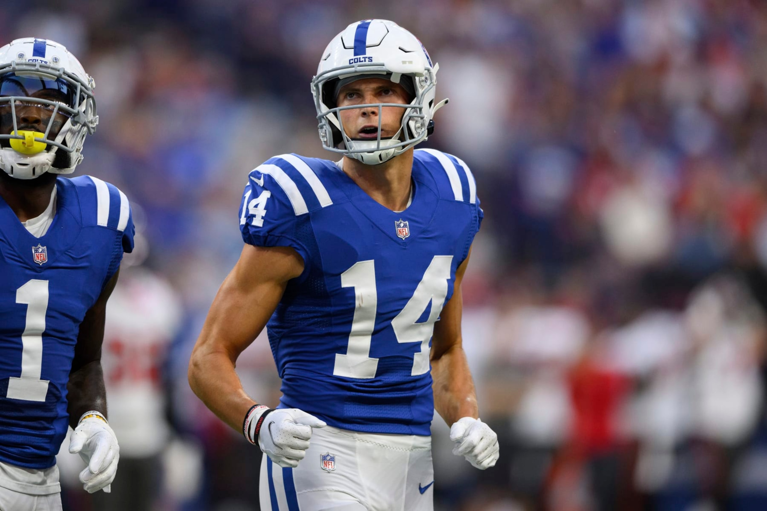 Indianapolis Colts wide receiver Alec Pierce (14) runs to the sidelines during an NFL football game against the Tampa Bay Buccaneers, Saturday, Aug. 27, 2022, in Indianapolis. (AP Photo/Zach Bolinger)